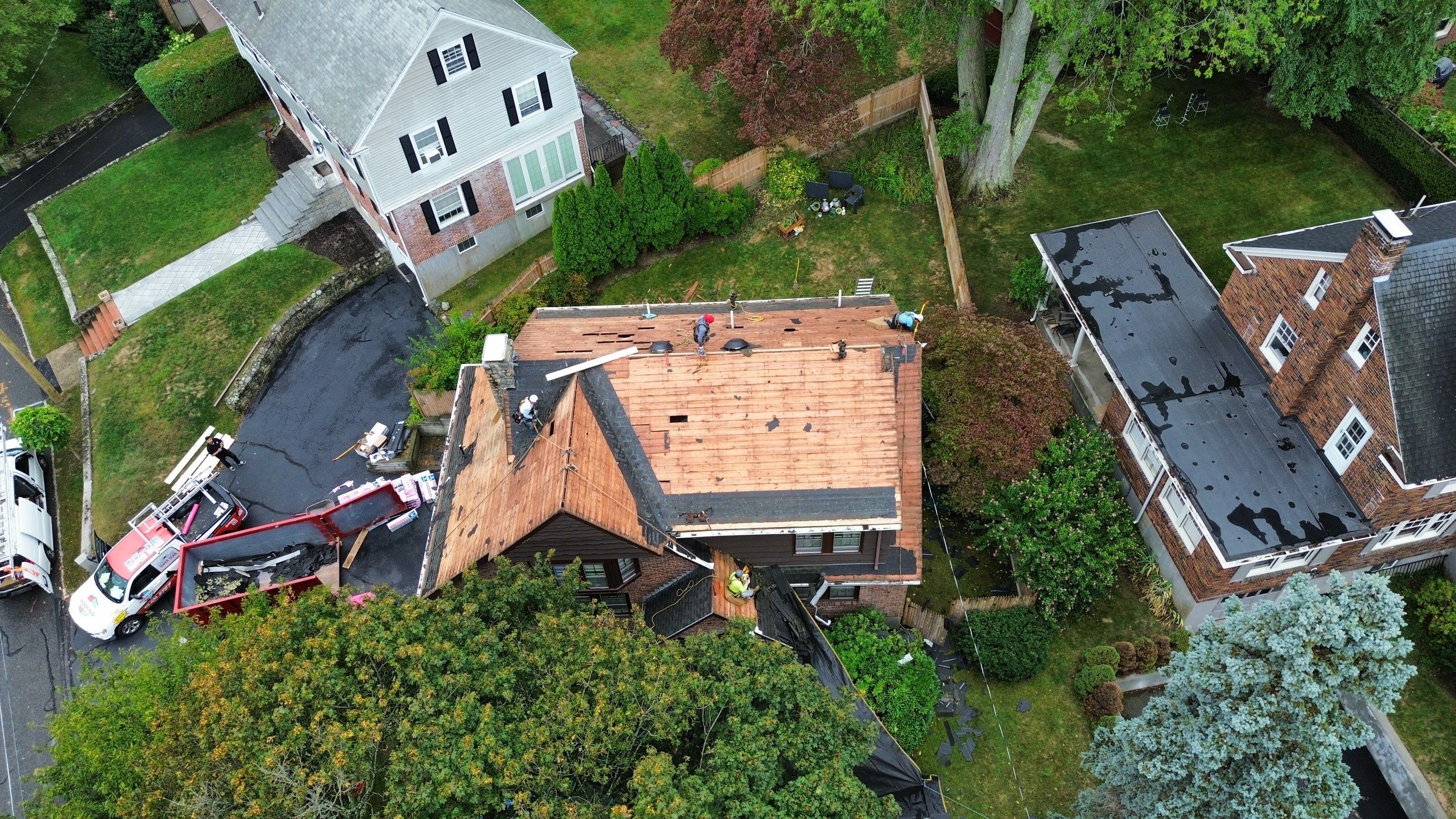 Roof Replacement with Skylight & Downspout Work in Belmont, MA by Mighty Dog Roofing of Greater Middlesex County