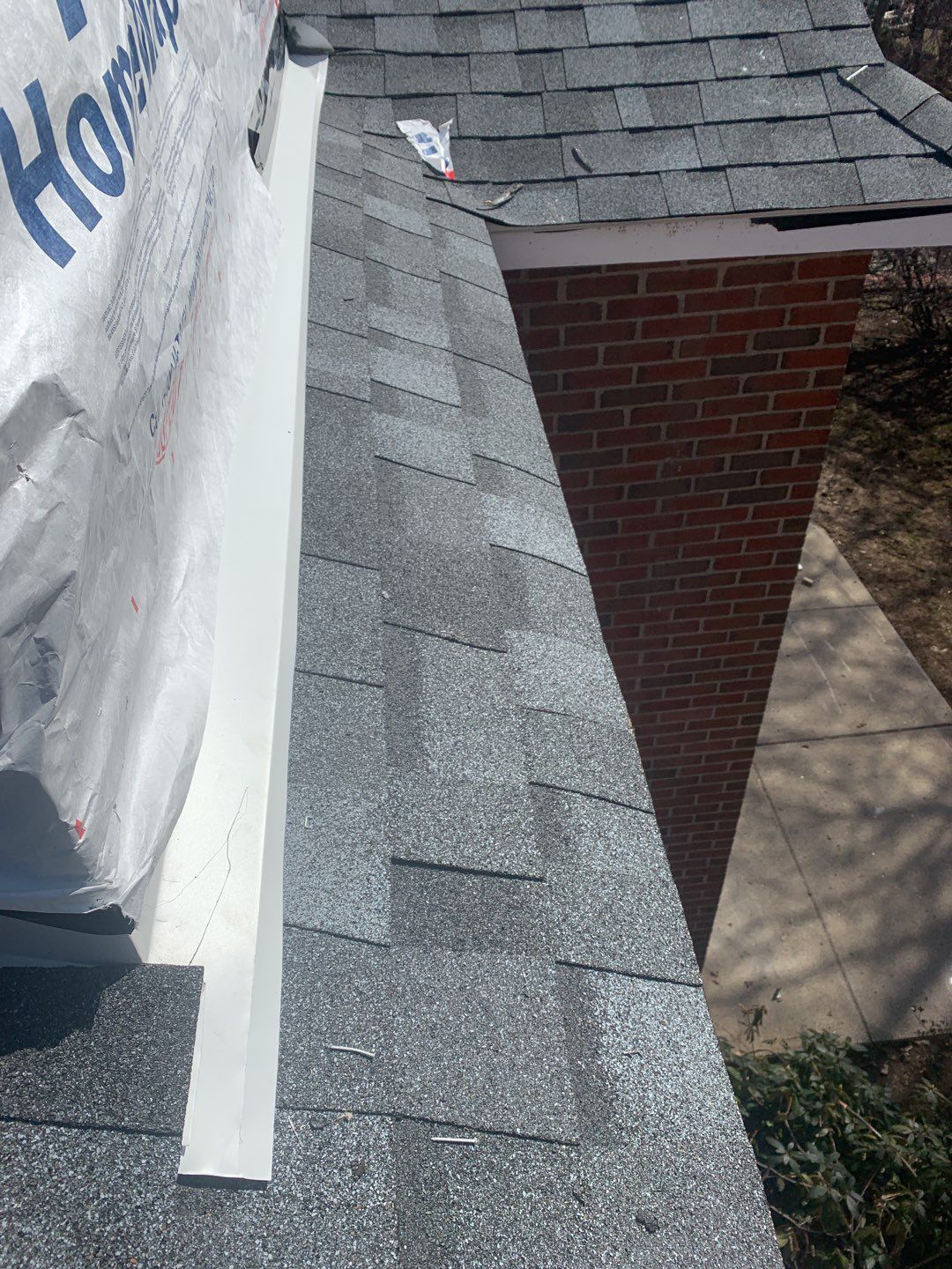 Commercial Roofing Installation using EPDM with white gutters by A Plus Exterior