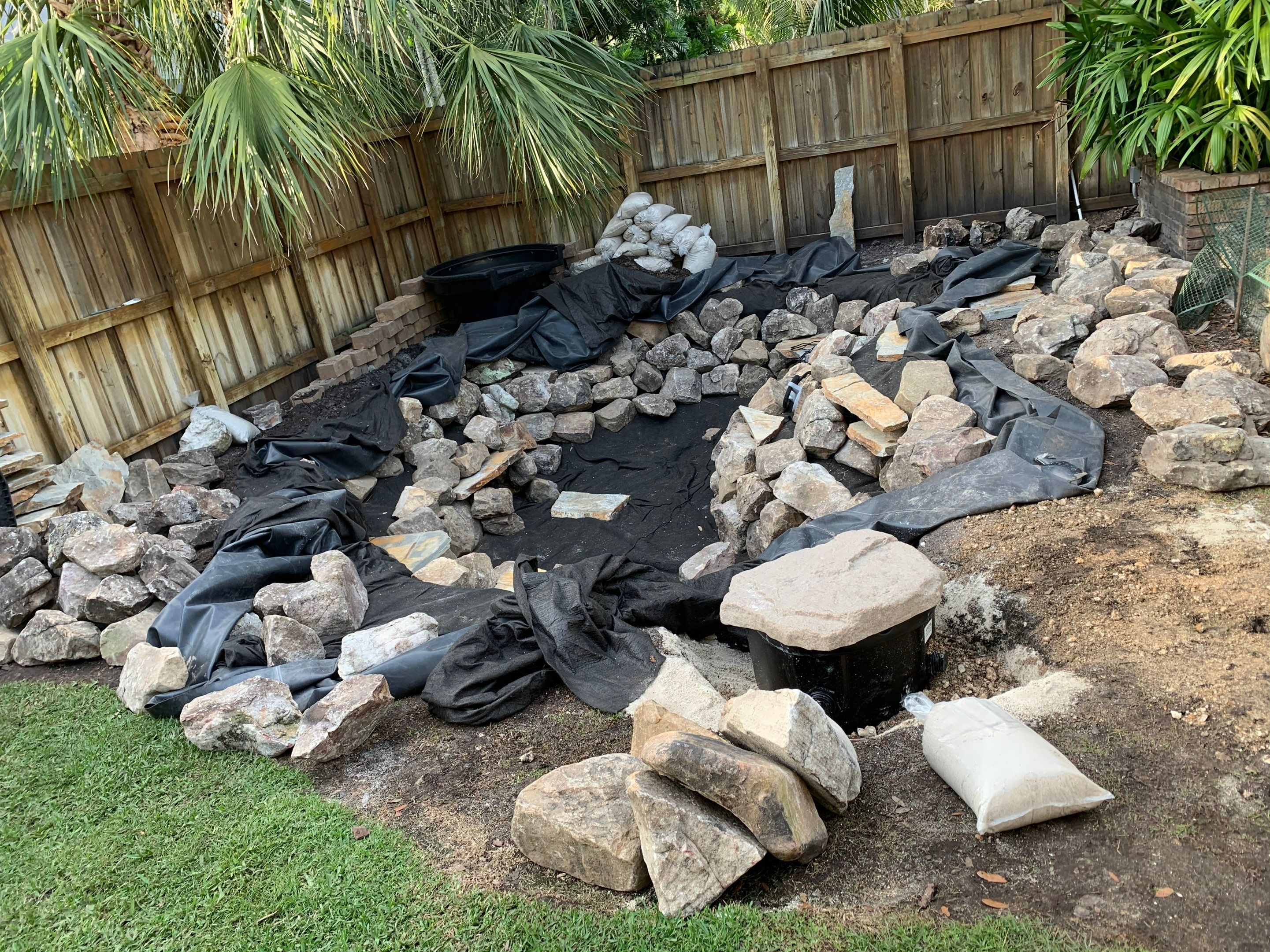 Small Koi Pond by Nature's Dream Landscape and Tree Service