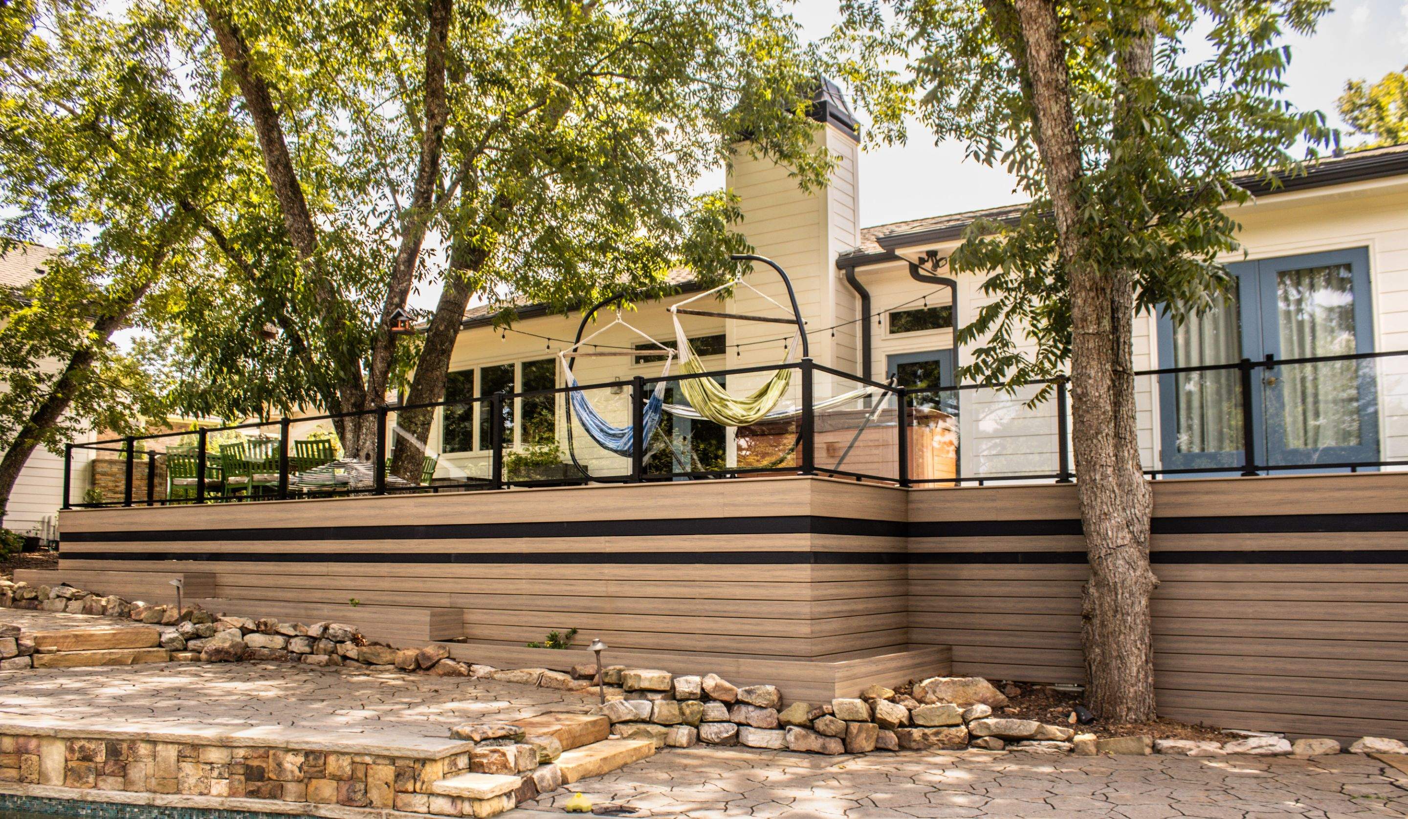 Deck Resurface with Glass Paneling and Deckorators Voyage Series Products by Nelson Exteriors 