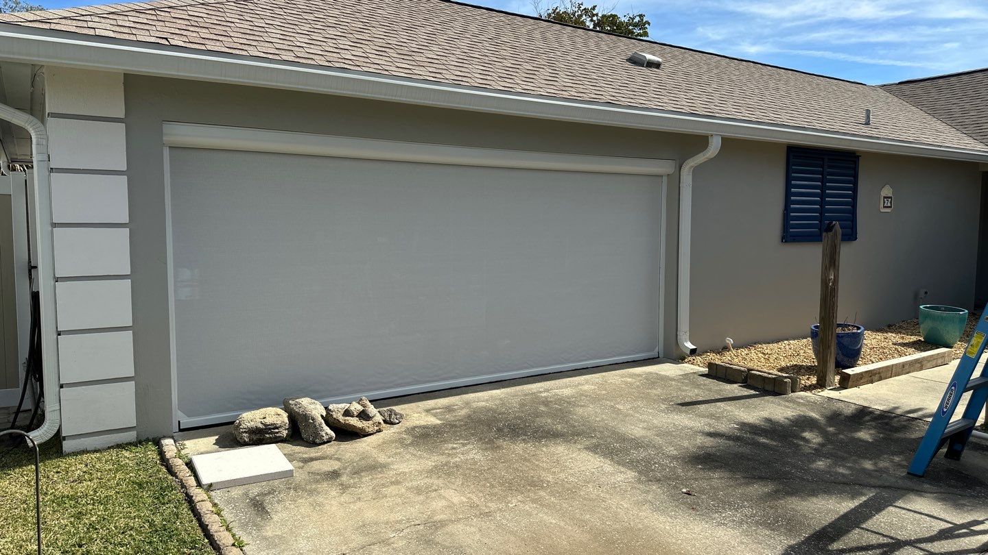 Hurricane Rated Bahama Shutters in Violet Blue / Motorized Bug Screen by Smart Guard Shutters