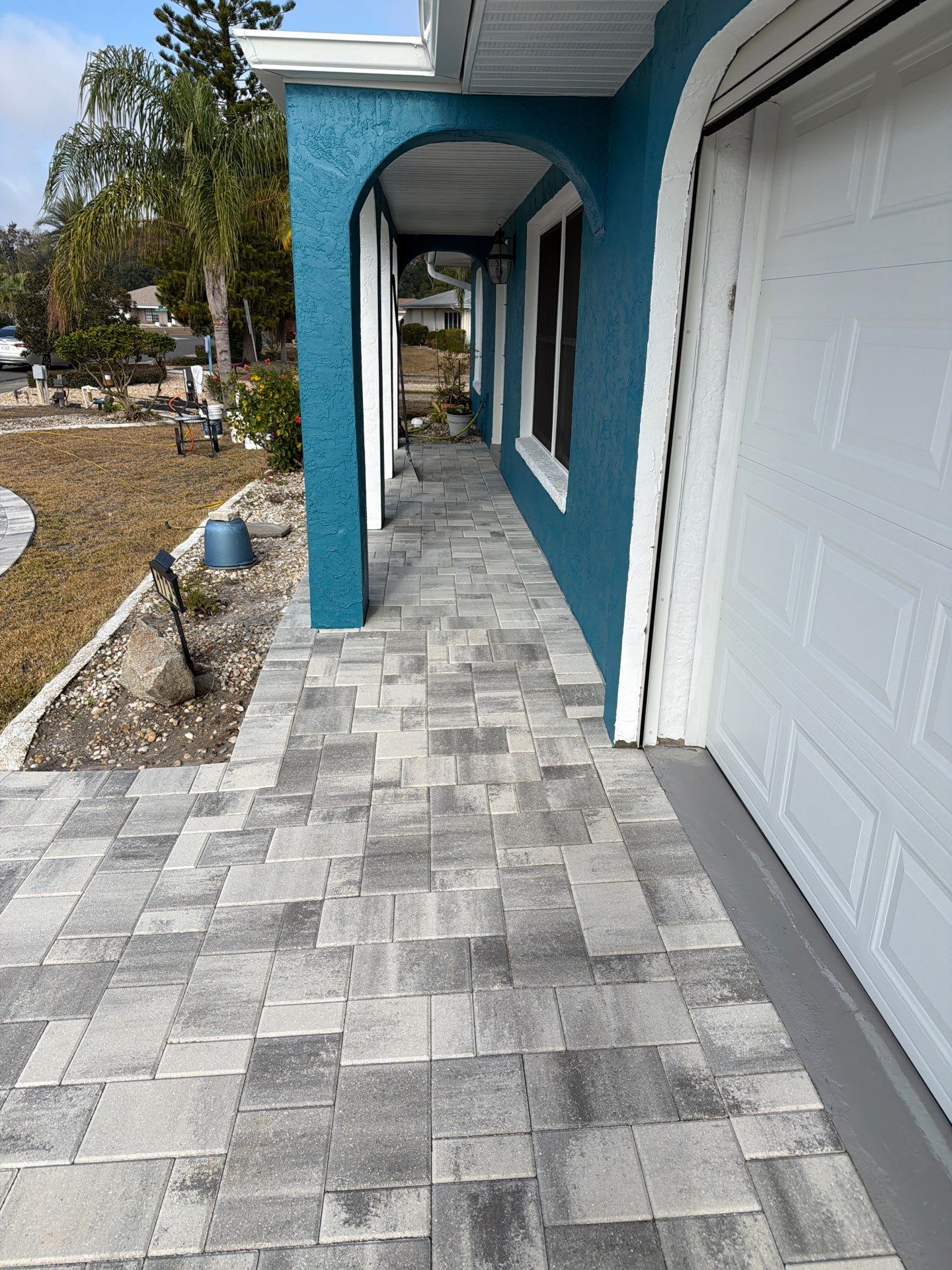 Modern Gray Paver Driveway and Entryway Walkway in Sun City Center by Supreme Paver Experts