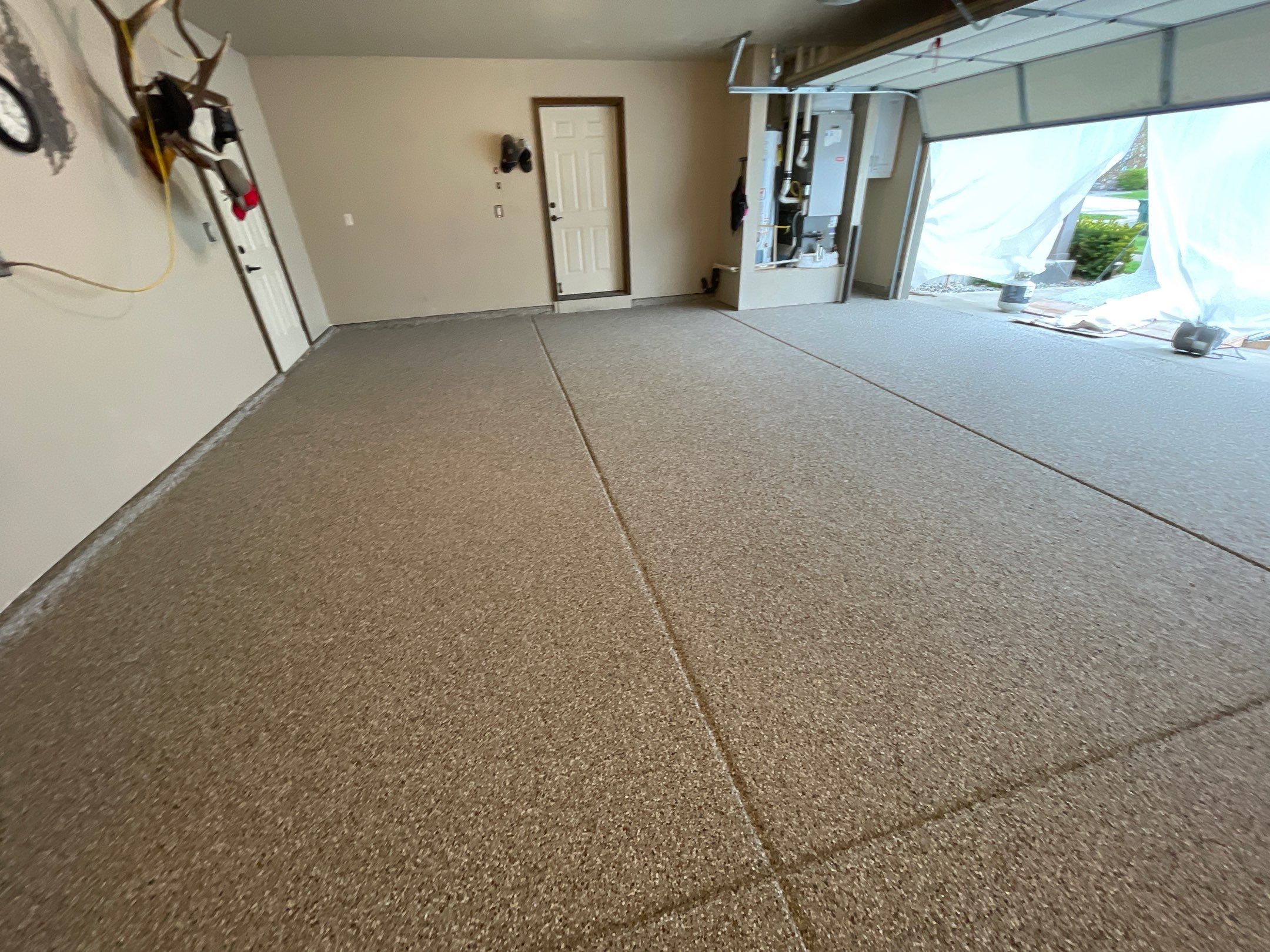 Garage Transformation using Pebble Beach and Front Porch using Greystone by Croc Coatings, LLC