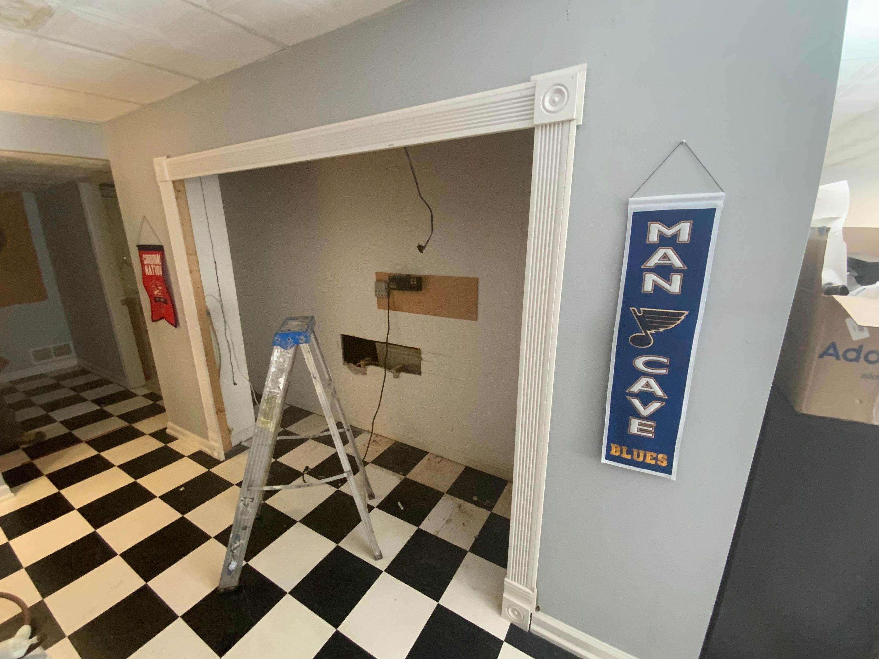Finished Basement Room Transformation with Wood-Look Flooring in Roswell by Swift Home Renovations