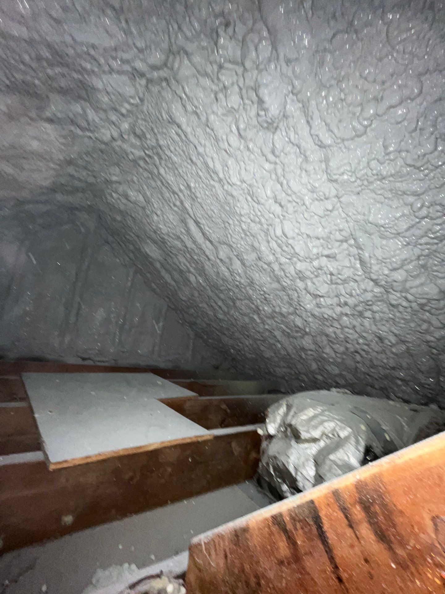 Attic Retrofit using open cell spray foam by NYS Foam & Energy