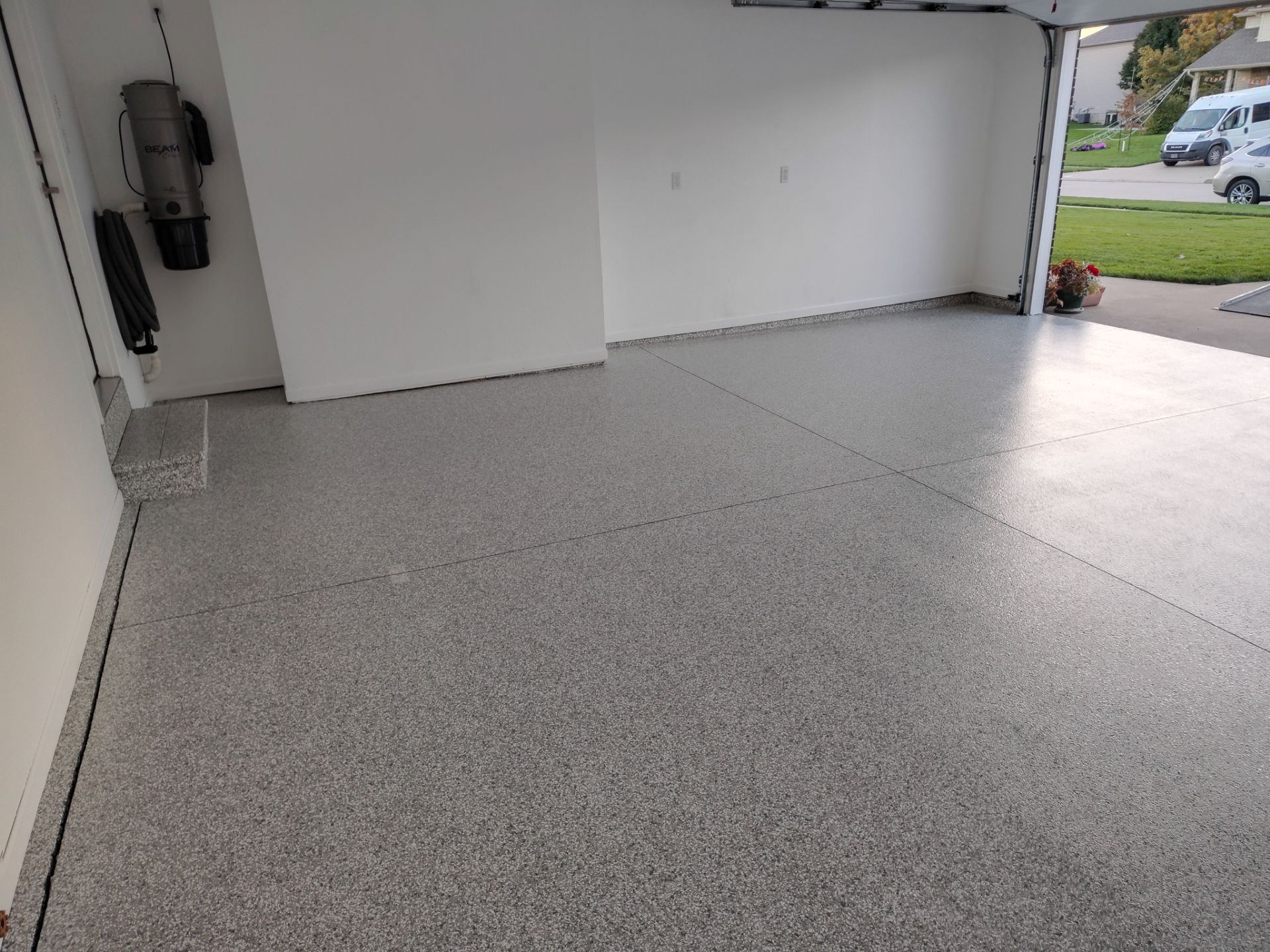 New Johnston Garage Resurfacing by Revival Concrete Coatings, LLC