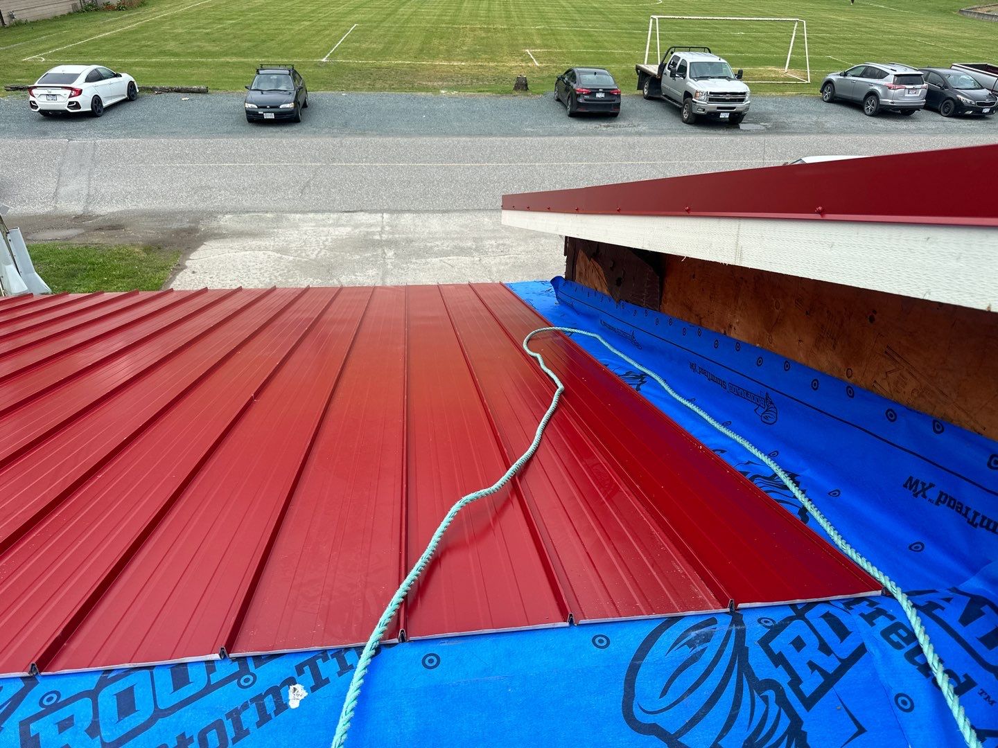 Commercial Roofing Installation using 12" Prolok metal  by Top Notch Roofing Inc