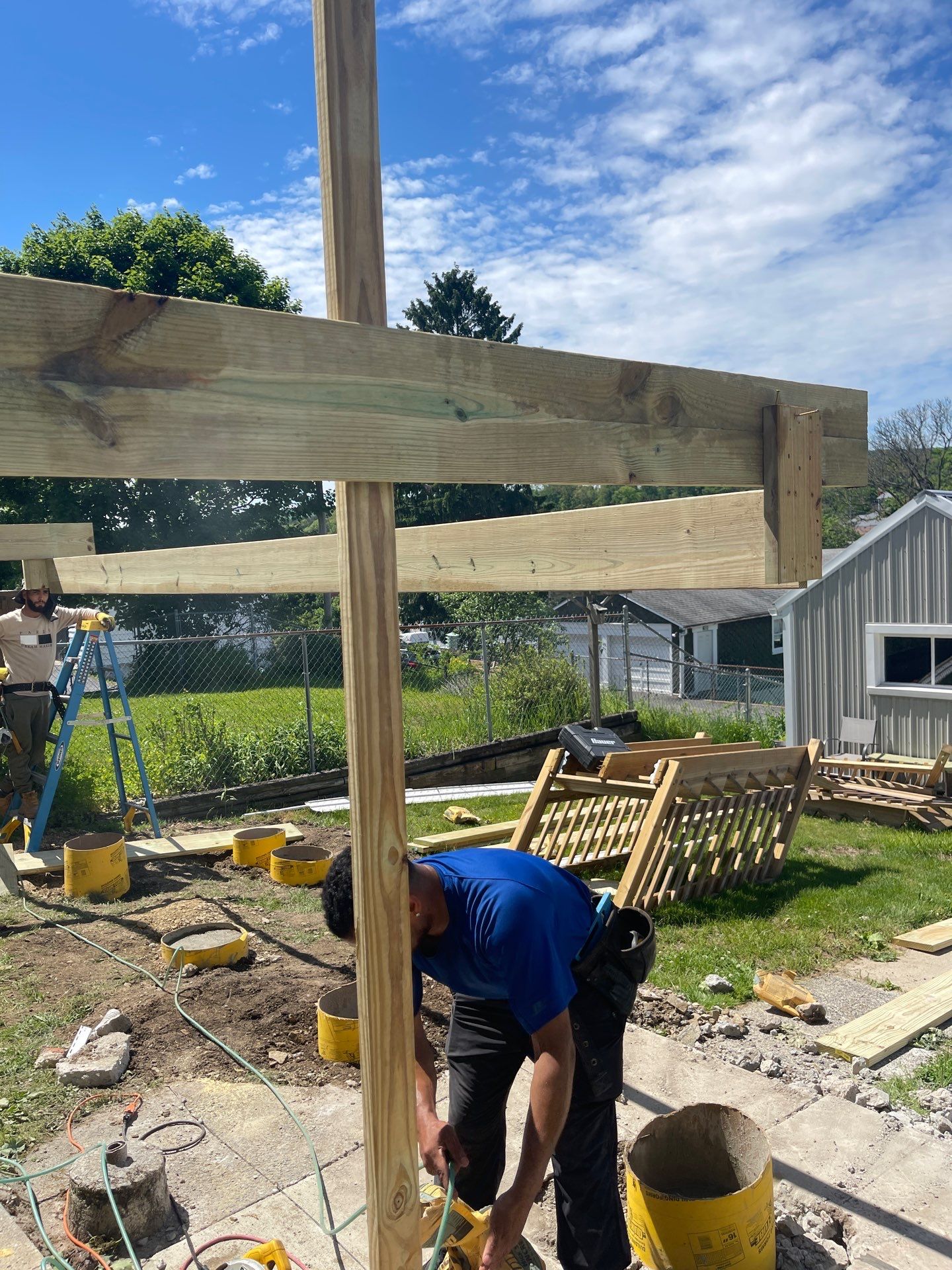 Pressure-Treated Wooden Staircase and Concrete Footing Installation in Schuylkill Haven by Herts Roofing & Construction