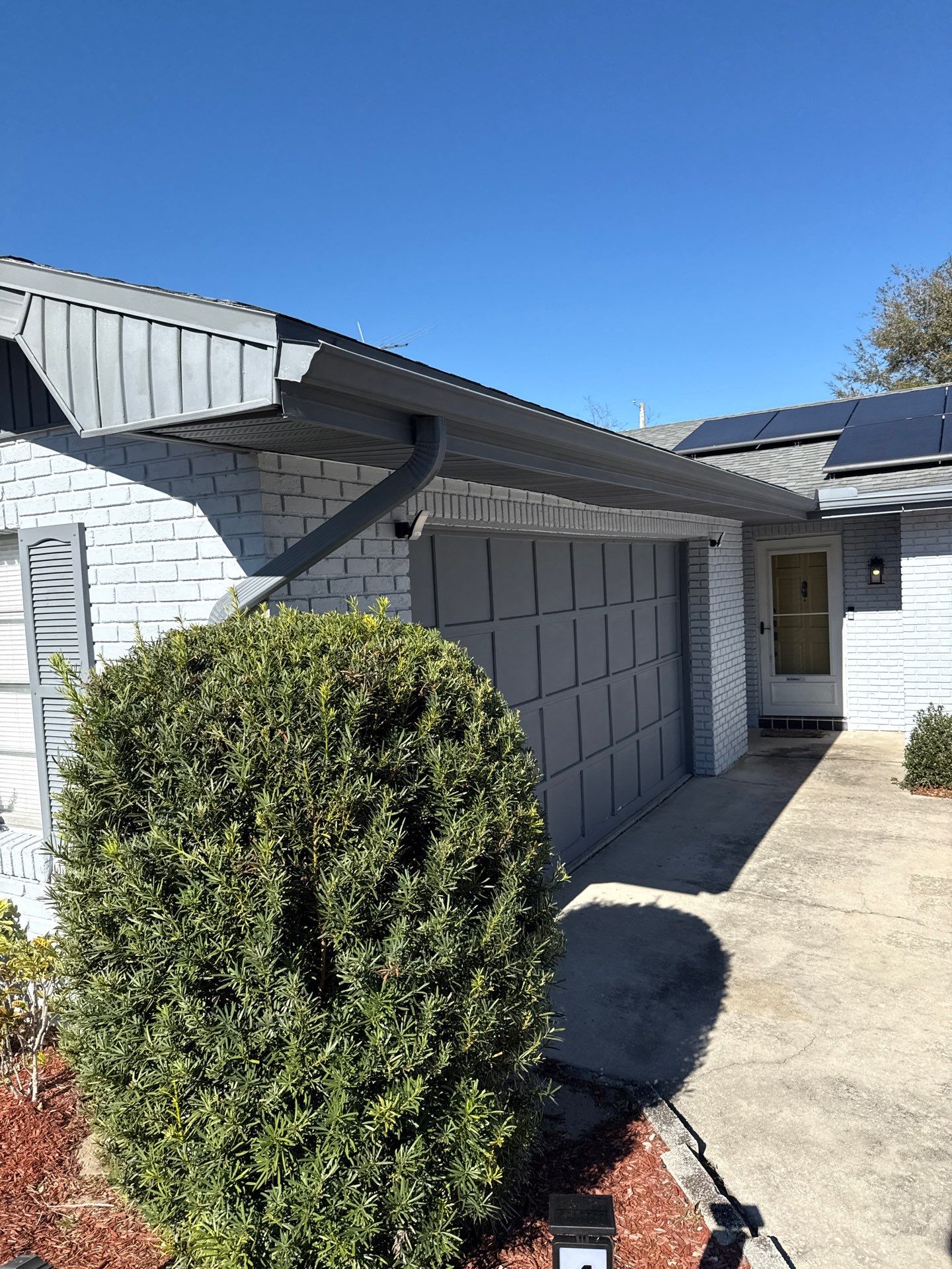 Downspout Installation using Downspout Extension and new Gutters in Winter Haven FL by Gutter Professors