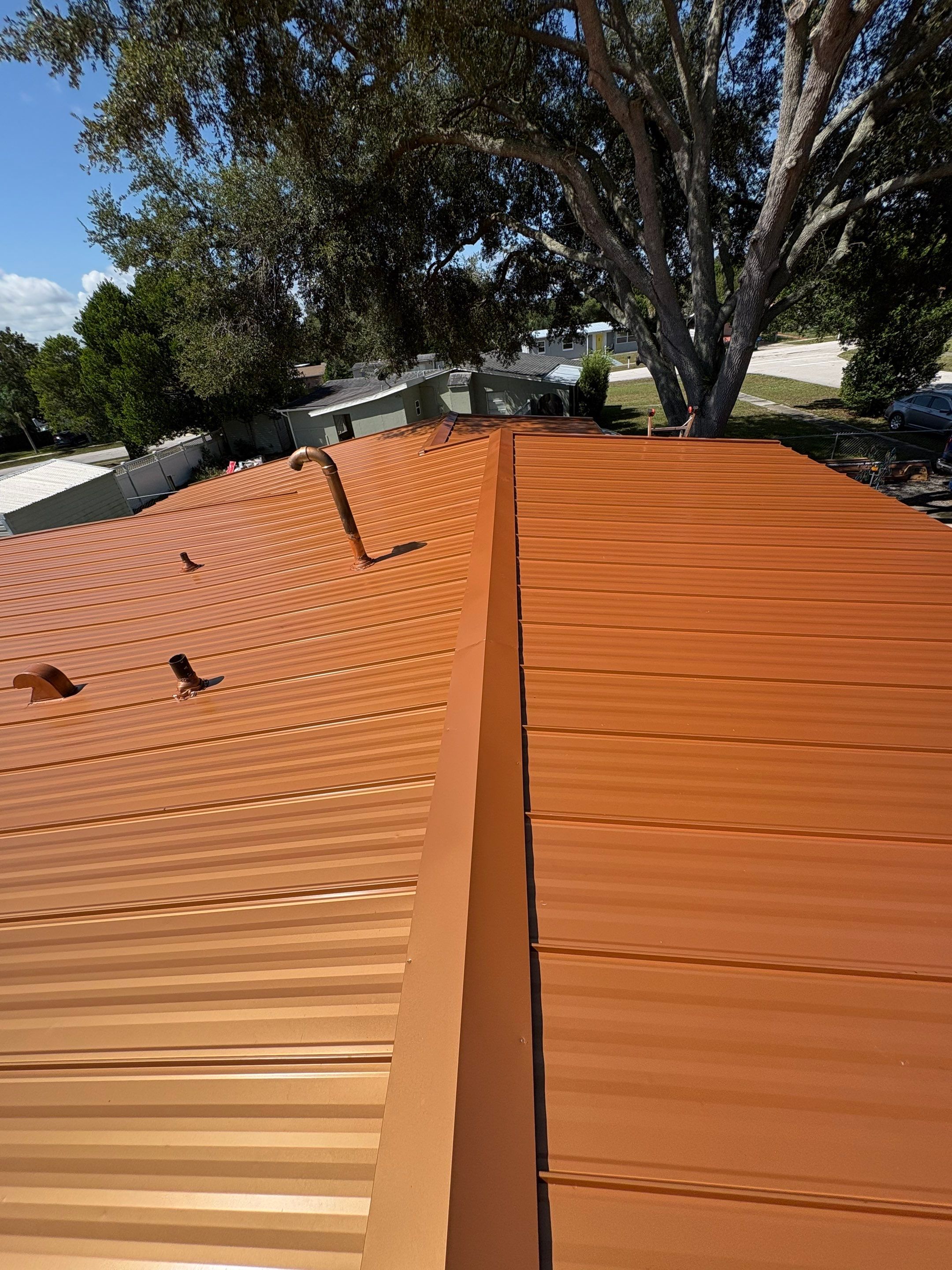 Standing Seam Metallic Copper Metal Roof Replacement in Deltona by Pinnacle Roofing Group