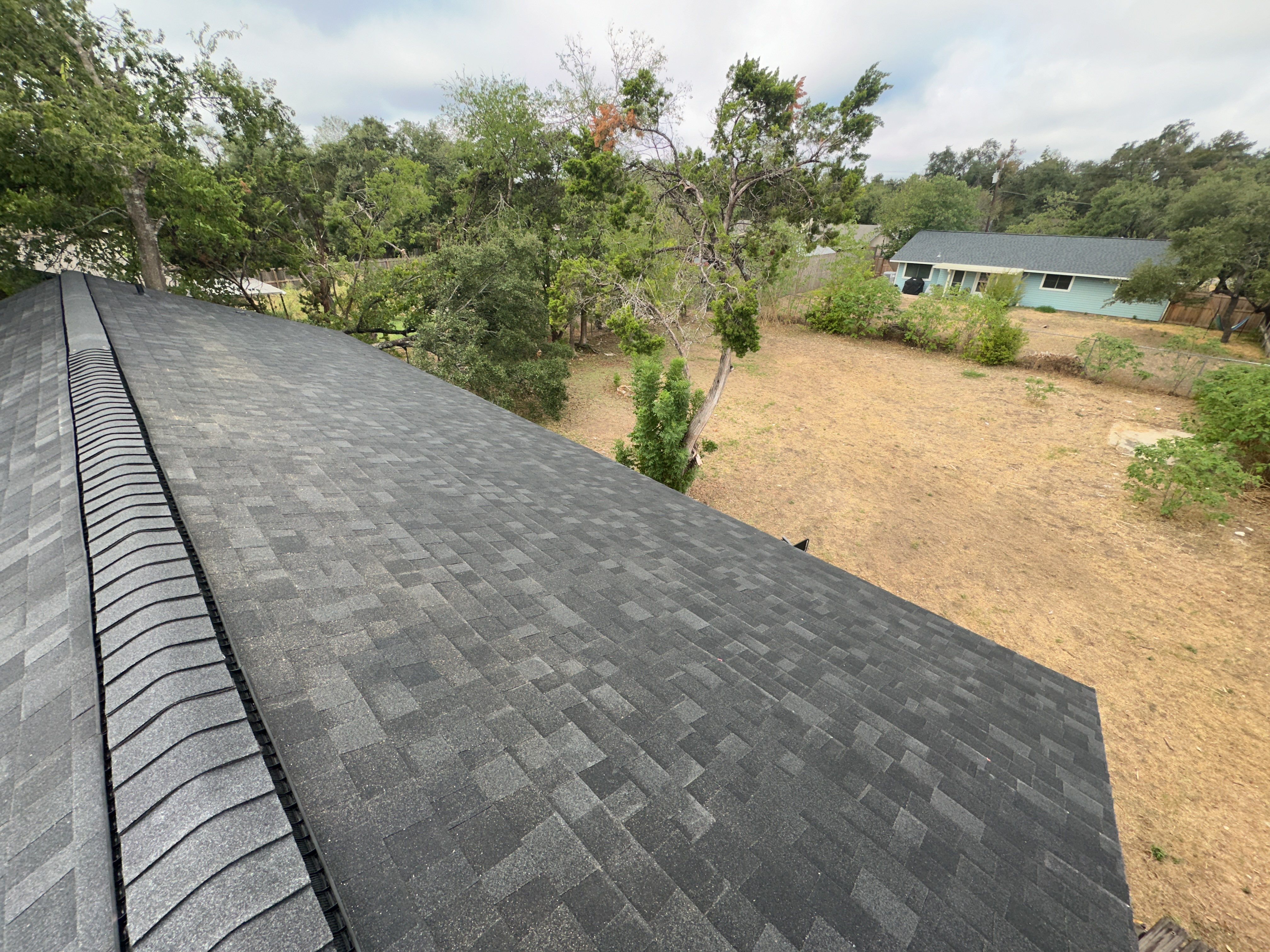 Charcoal Shingle Roof Replacement in Cedar Park by Skywall Construction LLC