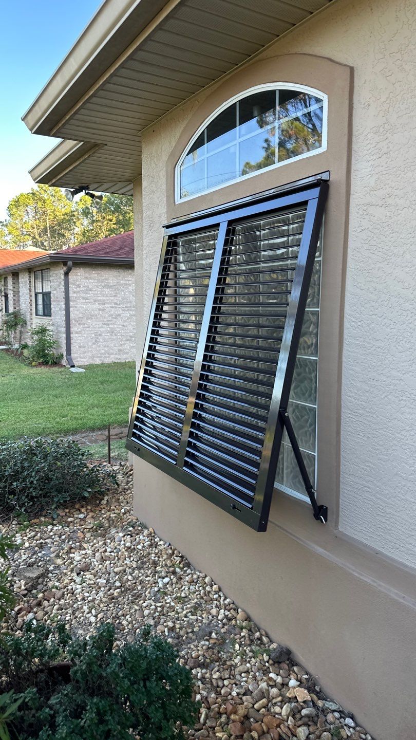 Hurricane Rated Bahama Shutters in Gray Brown by Smart Guard Shutters