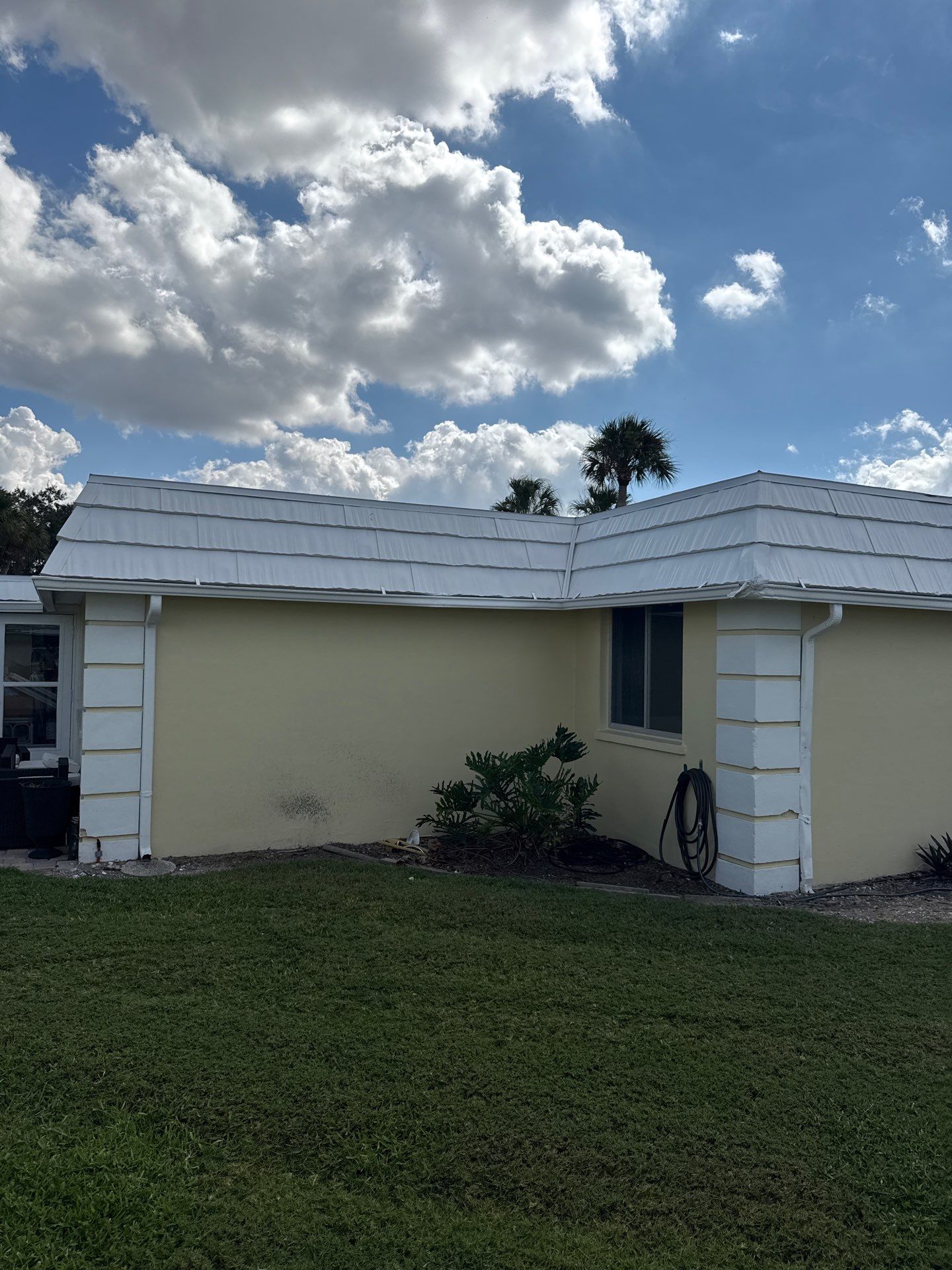 White Gutters and Matching Downspouts in Sarasota FL by Gutter Professors