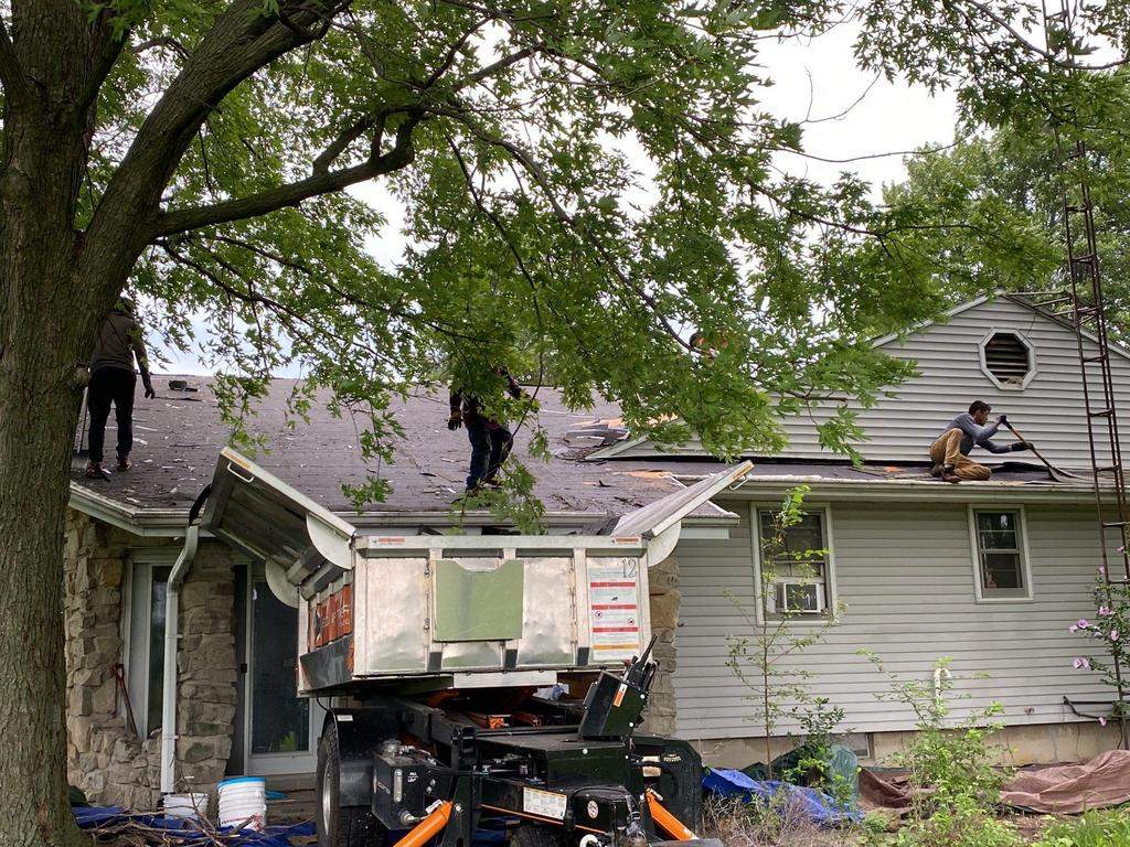 Storm damage roof replacement by Nitro Roofing and Construction