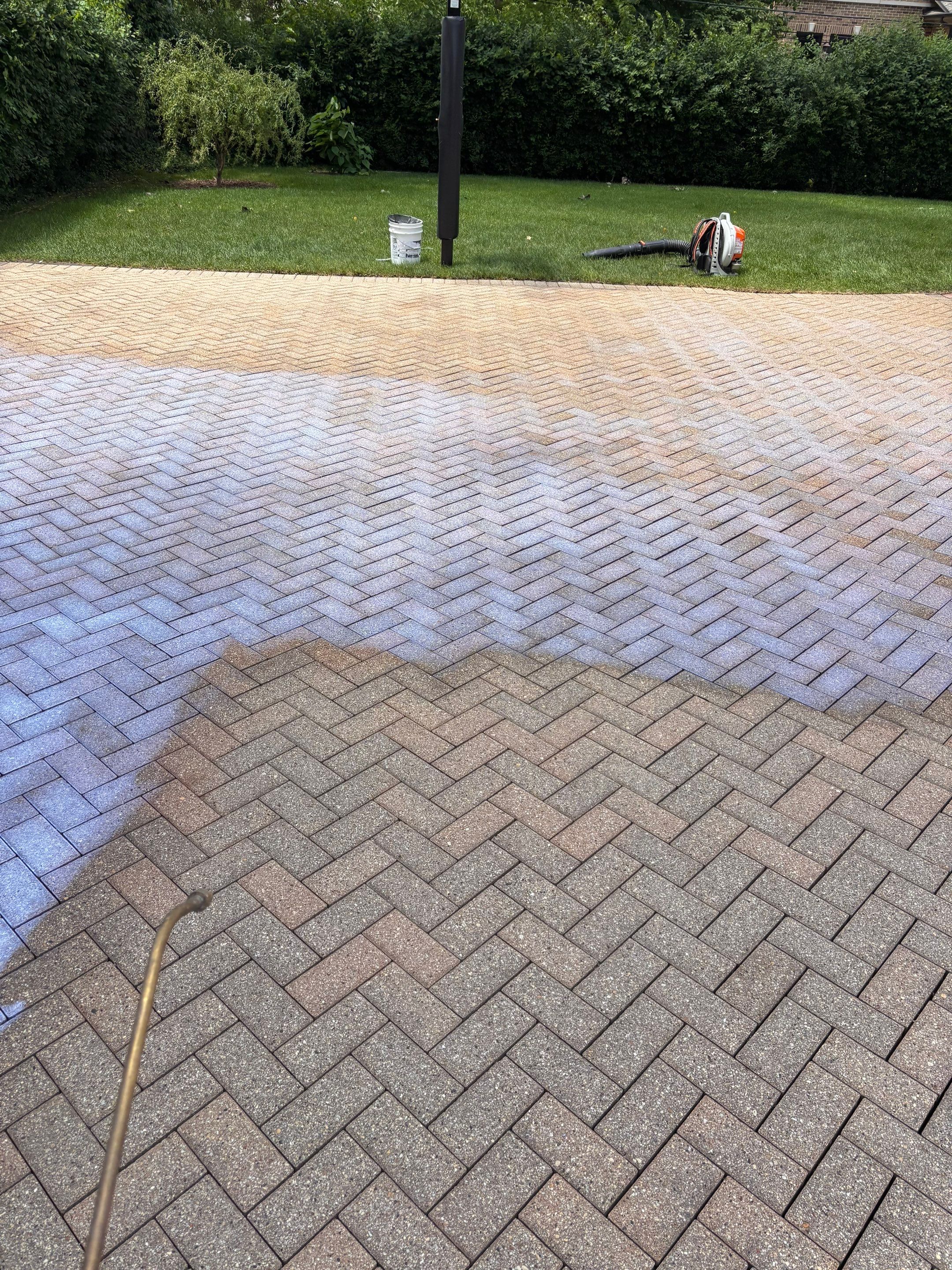 Brick paver repair, cleaning and sealing by Northern Power Washing LLC.