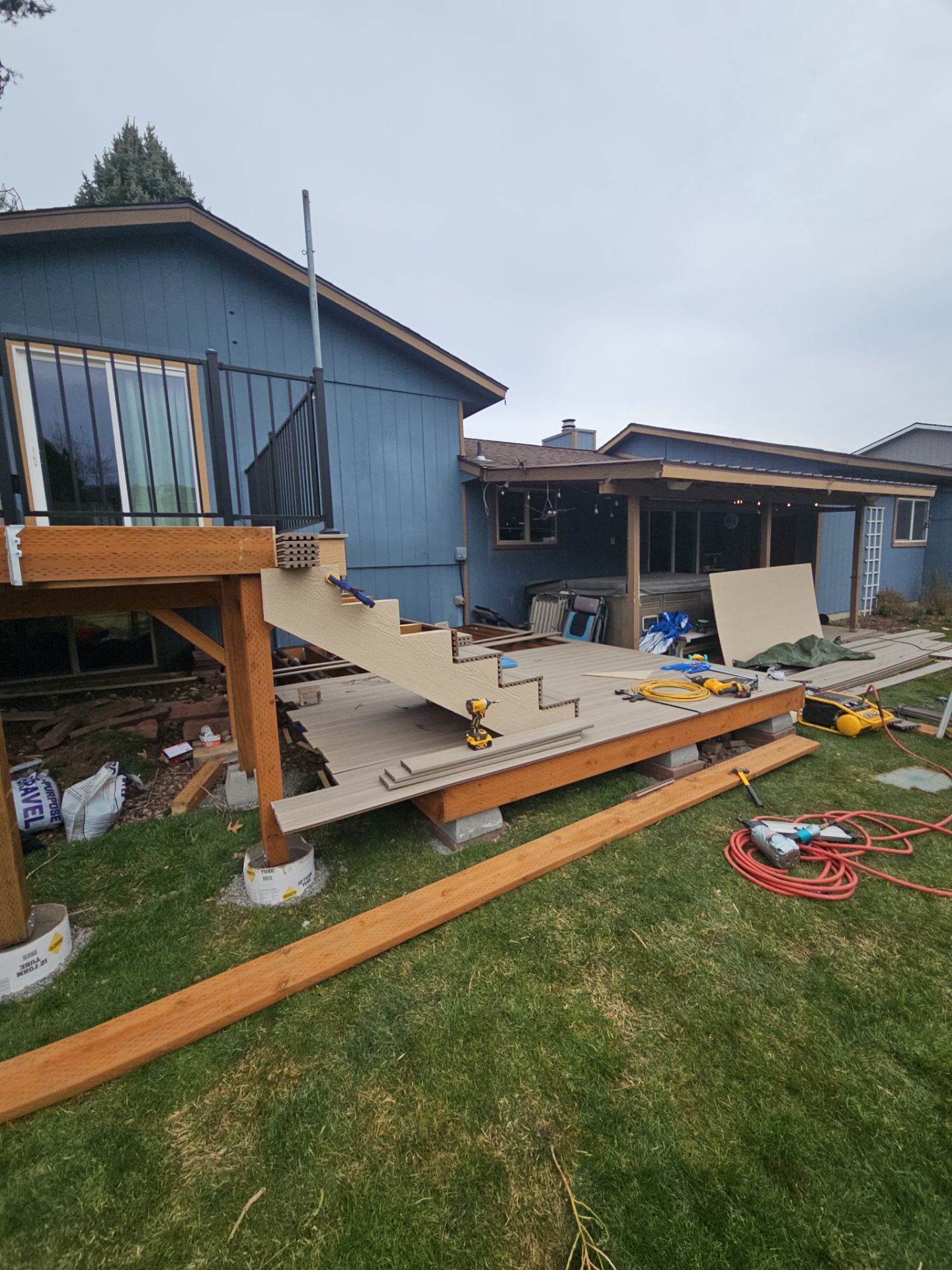 Add a platform deck below an existing elevated deck that was there prior by Home Helpers General Contracting