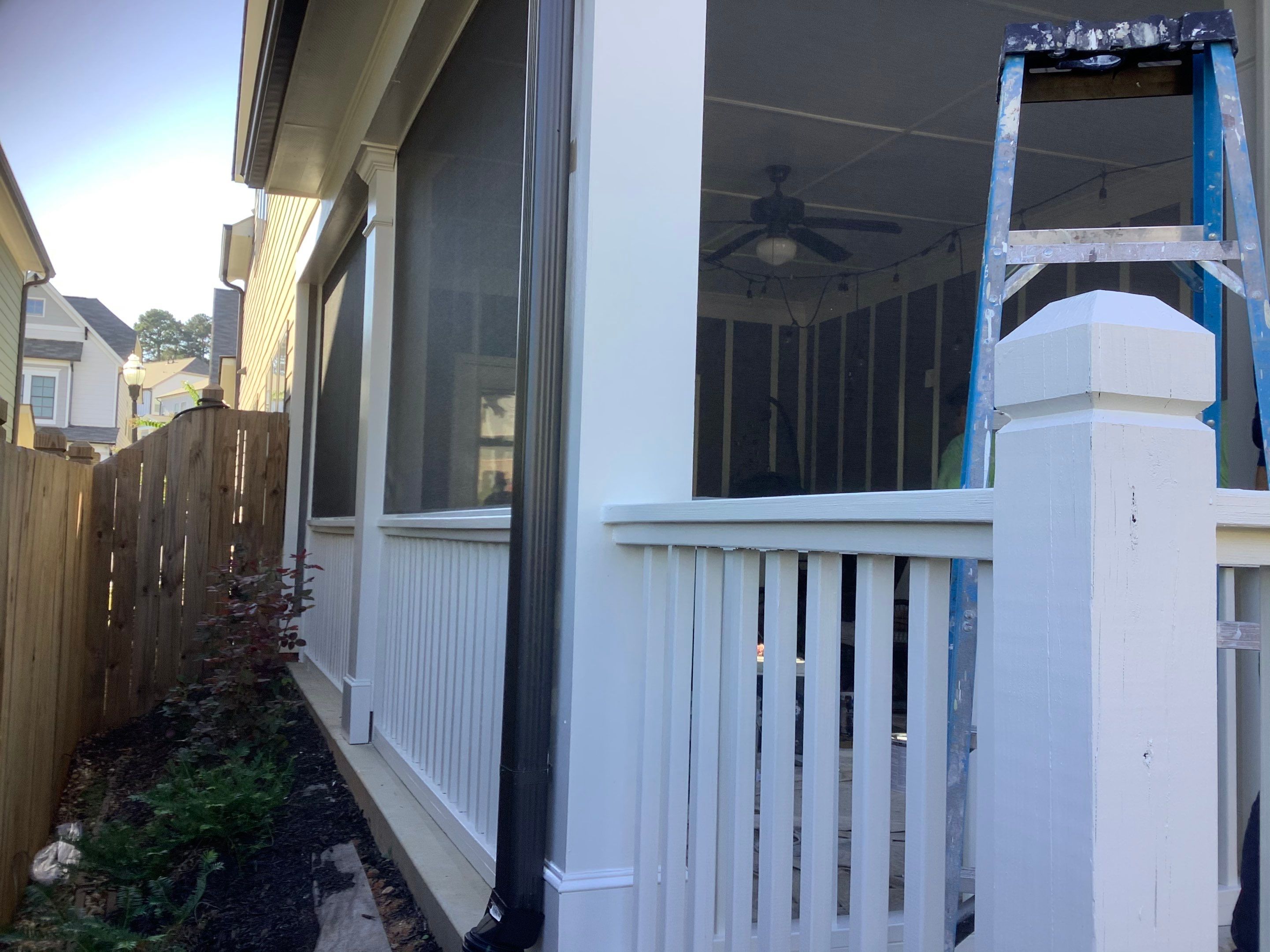 Custom Screened-In Porch Enclosure with White Railings in Smyrna by Swift Home Renovations