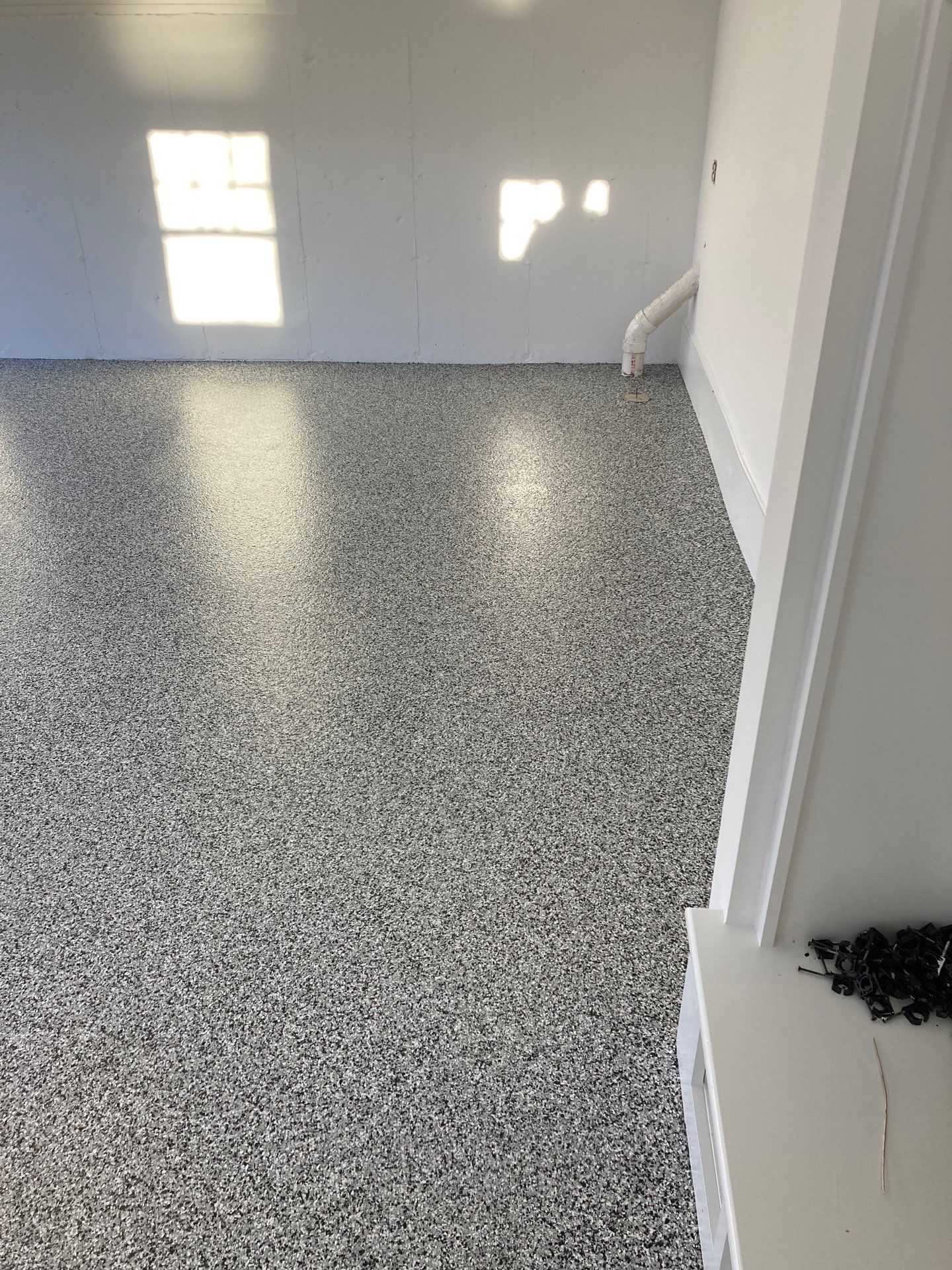 Garage in Mashpee, MA 02649 by Symphony Concrete Coatings