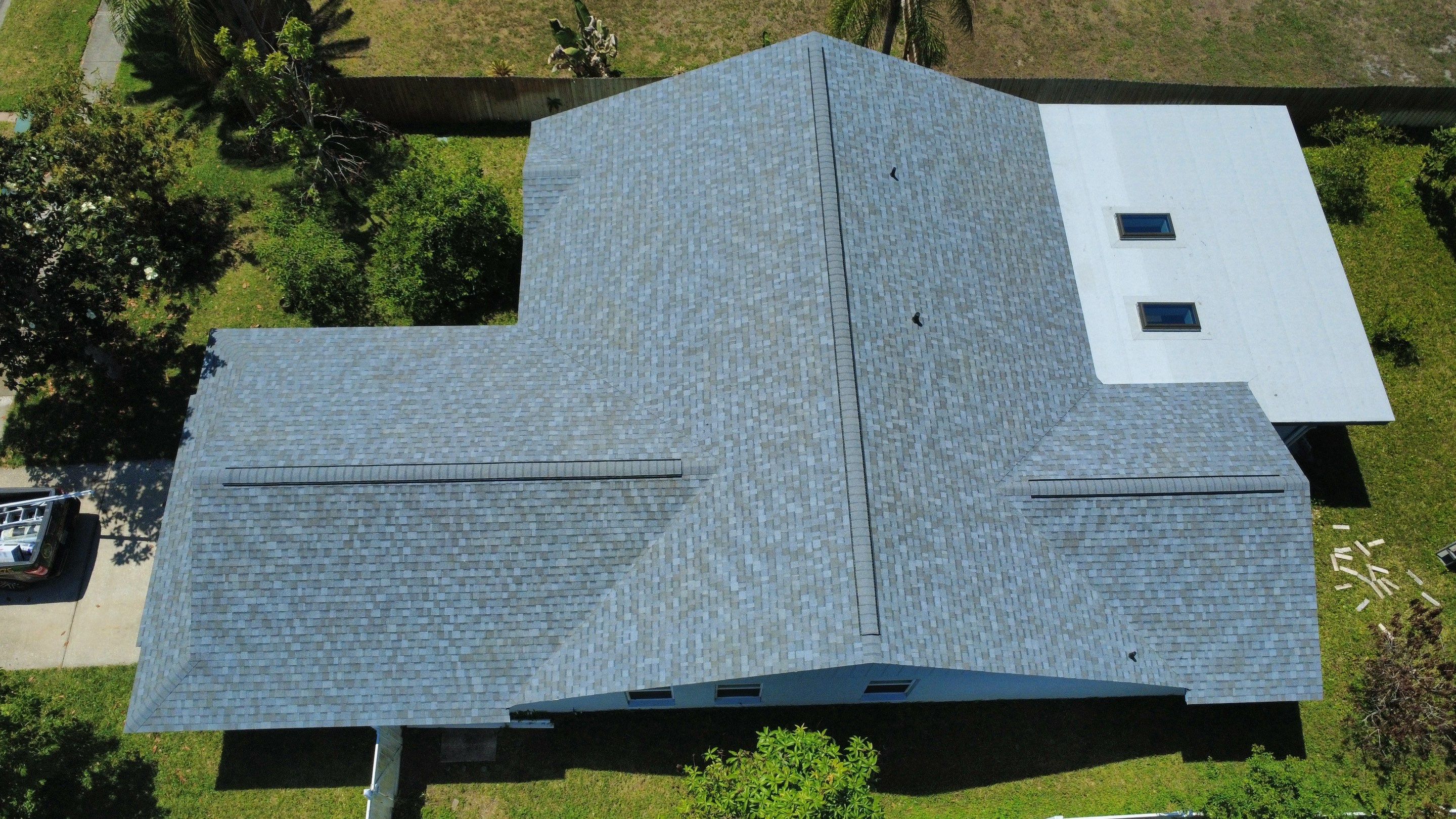 Owens Corning Shingle Roof Replacement and Skylight Upgrade in Tampa by Steadfast Roofing