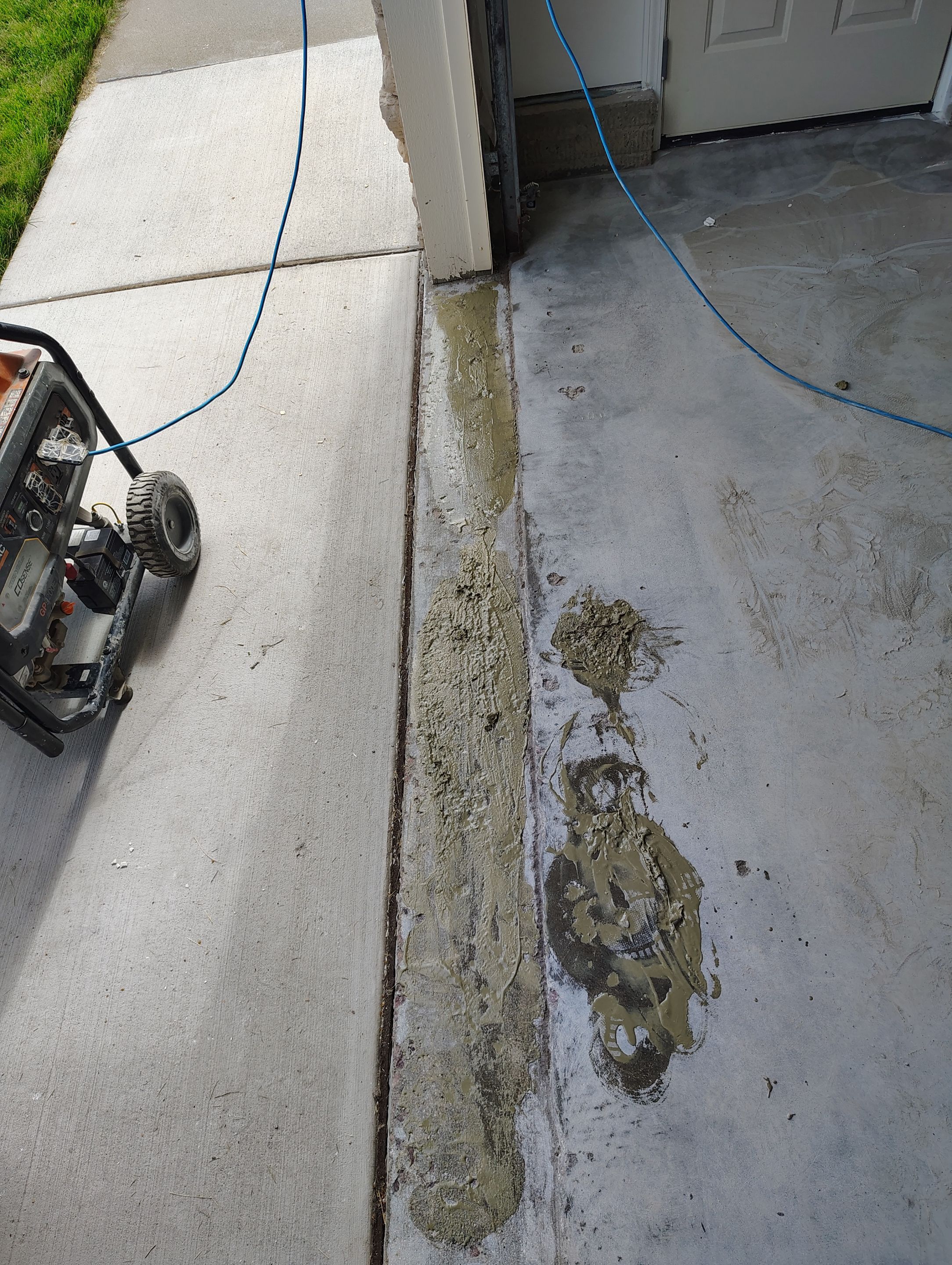 Custom Grey Speckled Epoxy Floor Coating for Sioux Falls Garage by Select Painting, Coatings & Garage Cabinets