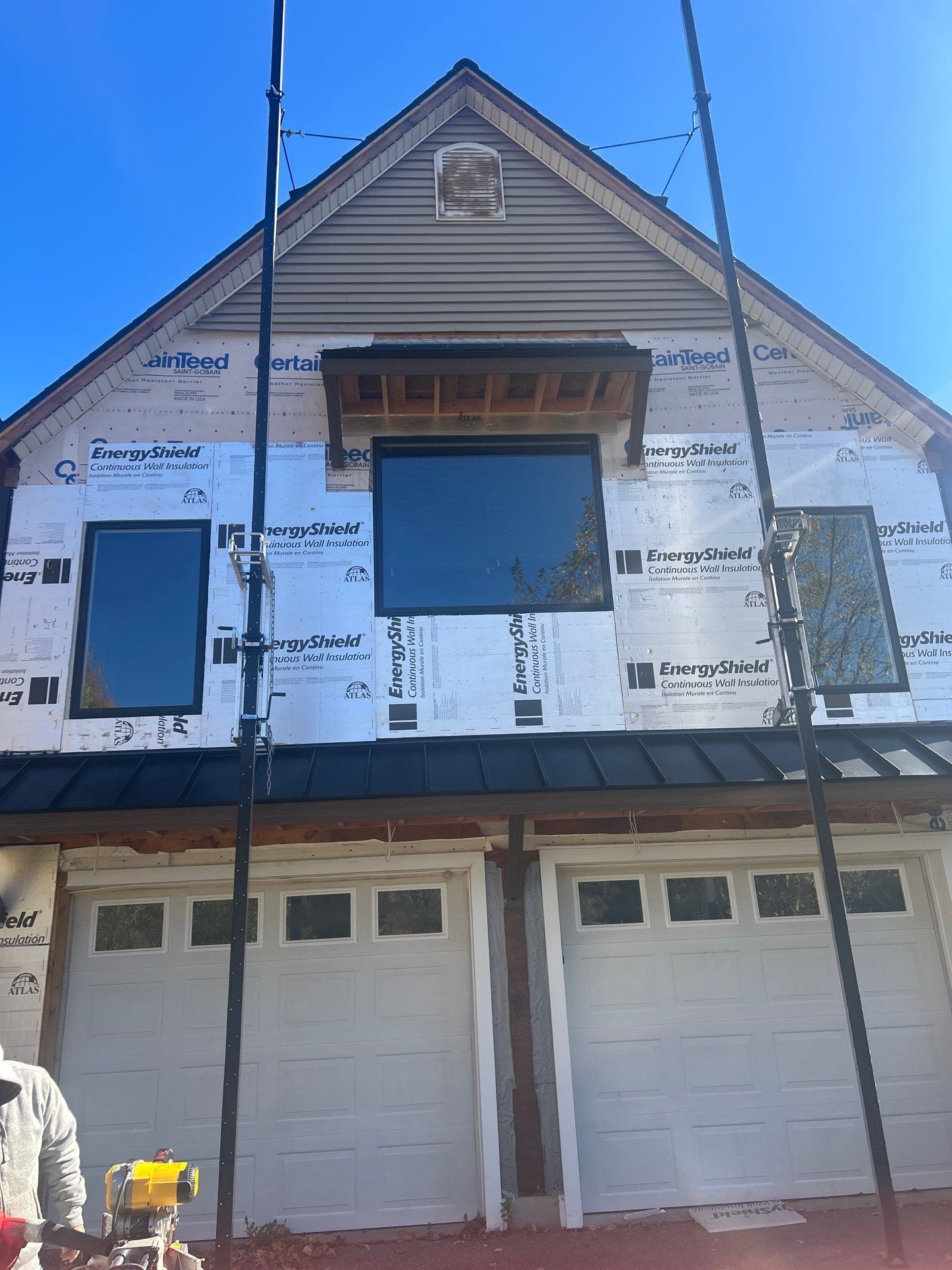 Bold Siding transformation with Cert Cedar Board & Batten S12, White, and Cert Monogram D/4 x 12'6" clapboard, Tuxedo by DiGiorgi Roofing and Siding Inc