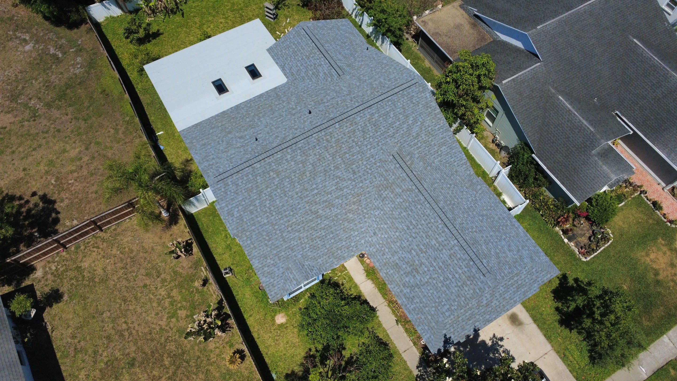 Owens Corning Shingle Roof Replacement and Skylight Upgrade in Tampa by Steadfast Roofing
