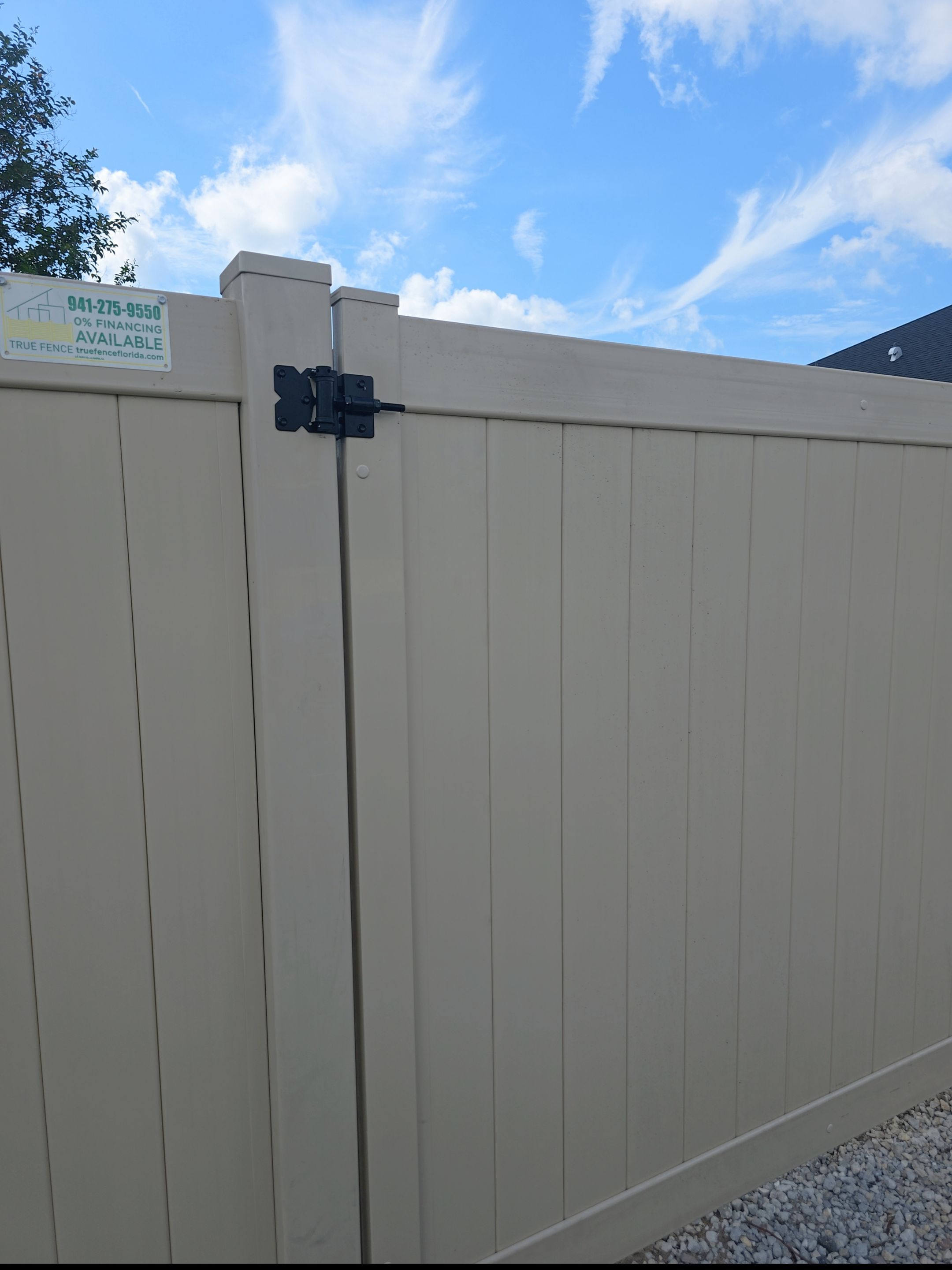 Tan Vinyl Privacy Fence and Gate Installation in North Port by True Fence LLC