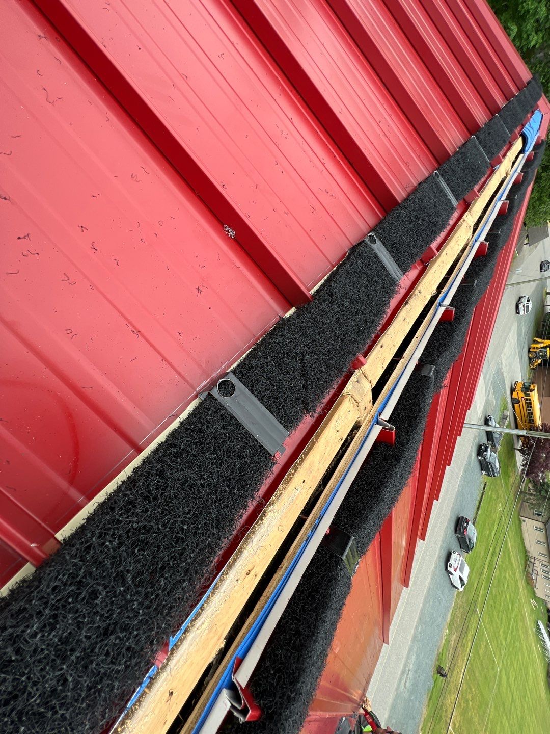 Commercial Roofing Installation using 12" Prolok metal  by Top Notch Roofing Inc