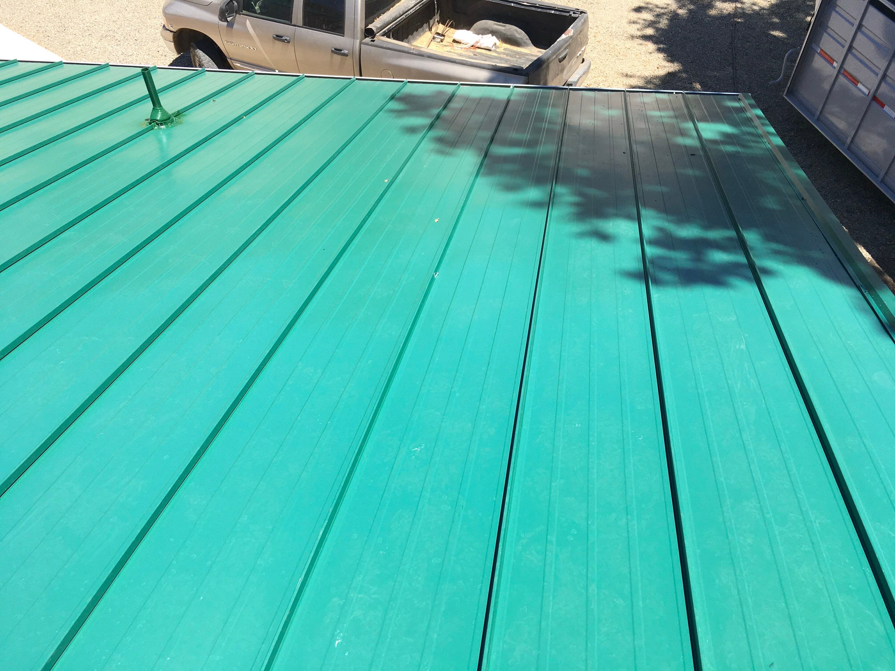 Metal roofing installation using Standing seam metal roofing system by Straight Edge Roofing Inc