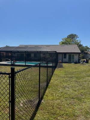 Black Chain Link Residential Backyard Fence Installation in North Port
