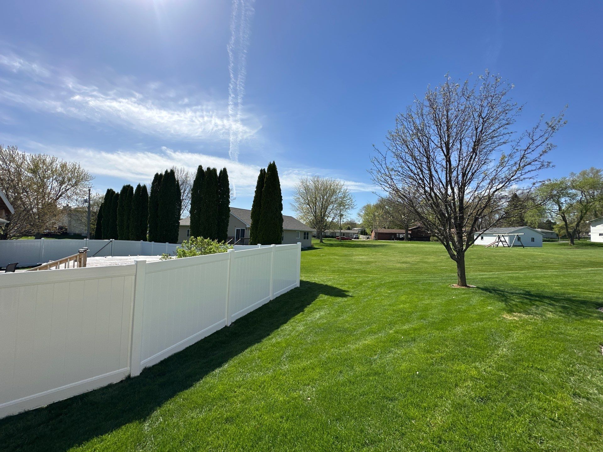 White Vinyl Privacy Fence Installation in Raymond, Iowa by Perfect Picket Fence and Stain