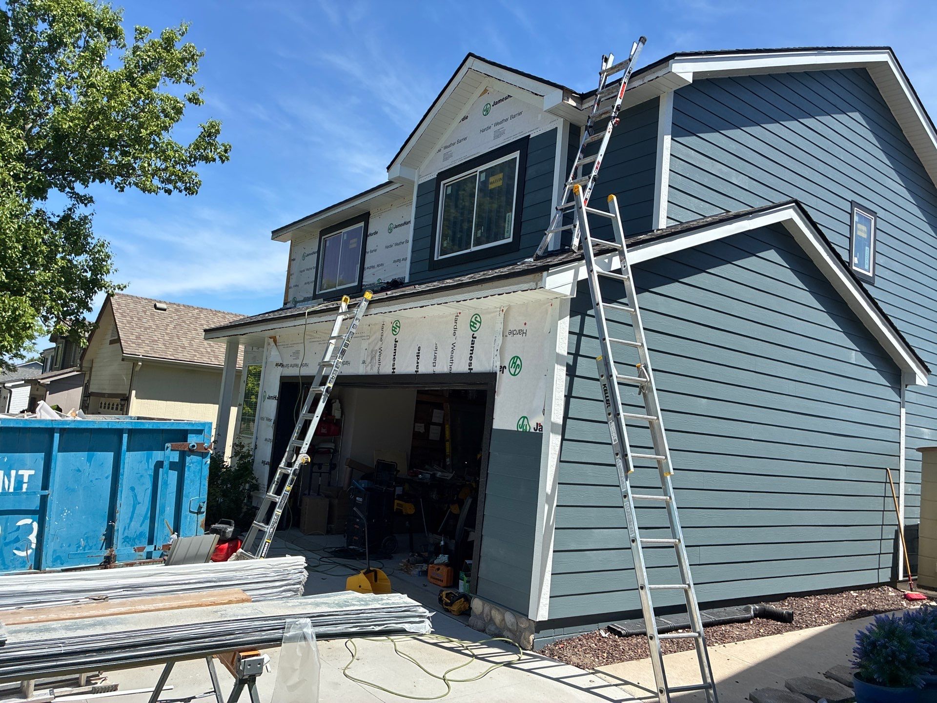 James Hardie Siding and Window Replacement with Arctic White Trim by Carps Complete Exteriors