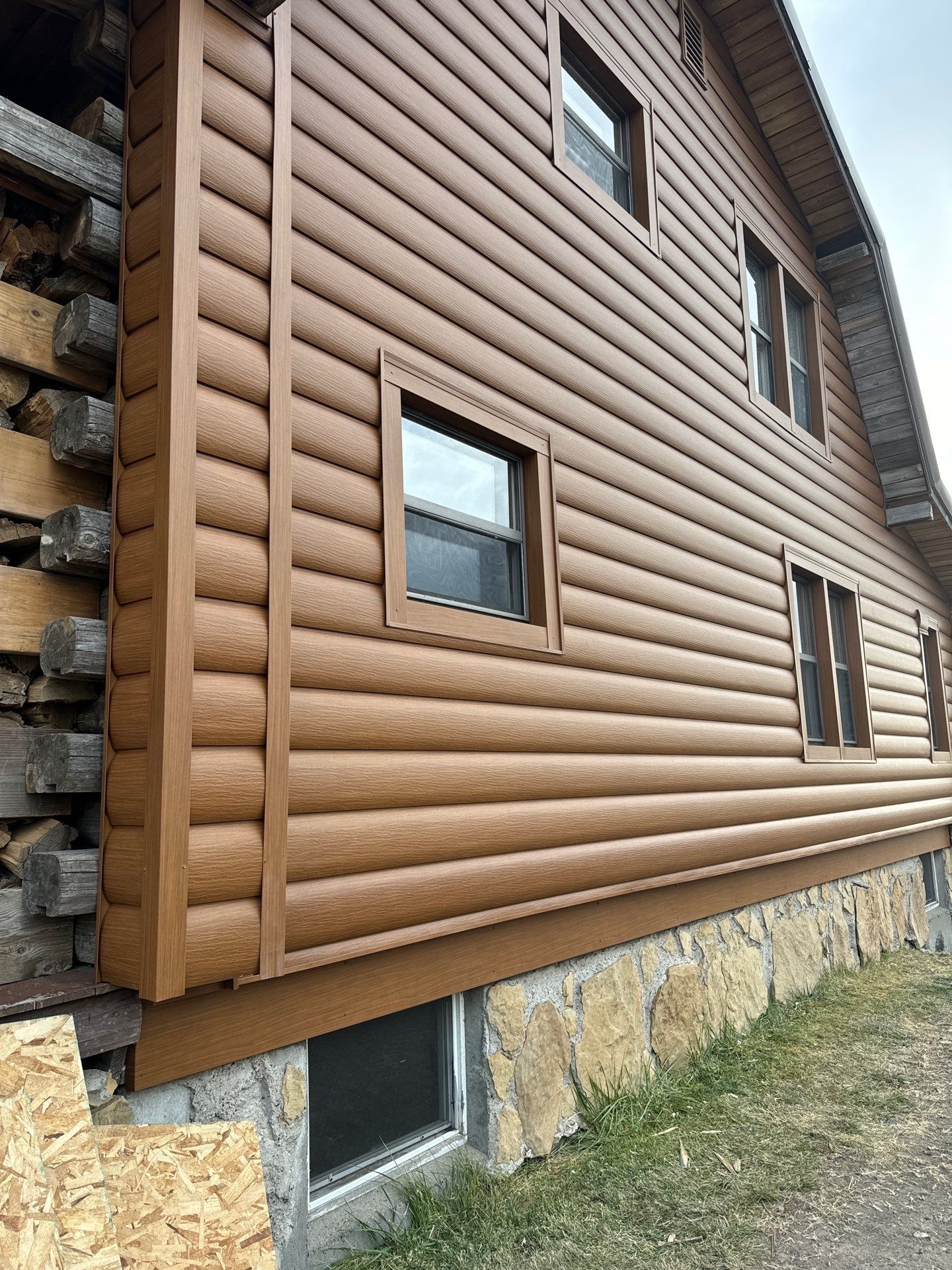 Siding Installation using Log Siding by Lynnrich Seamless Siding, Windows & Doors