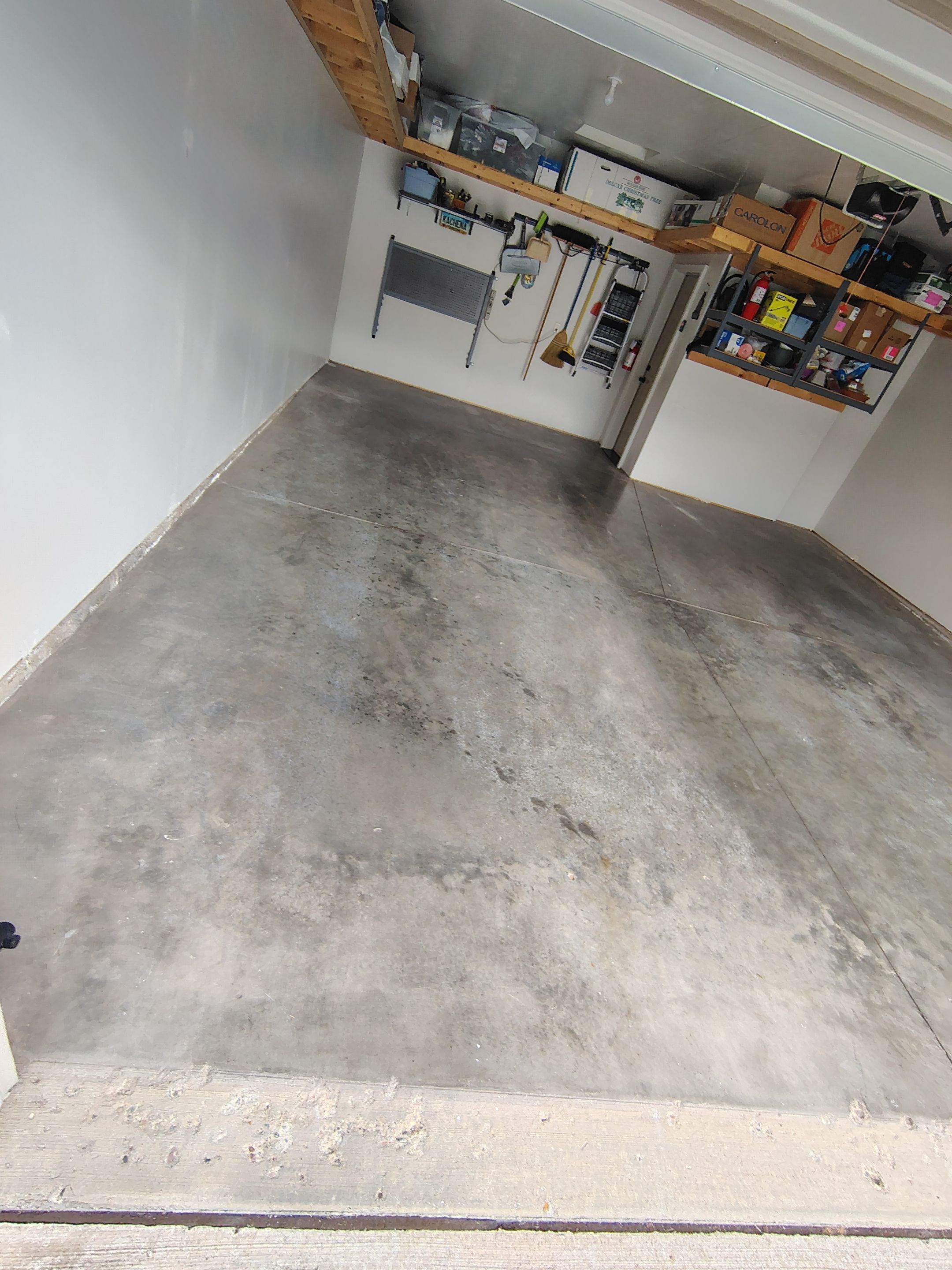 Decorative Chip Garage Concrete Coating Installation in Sioux Falls by Select Painting, Coatings & Garage Cabinets
