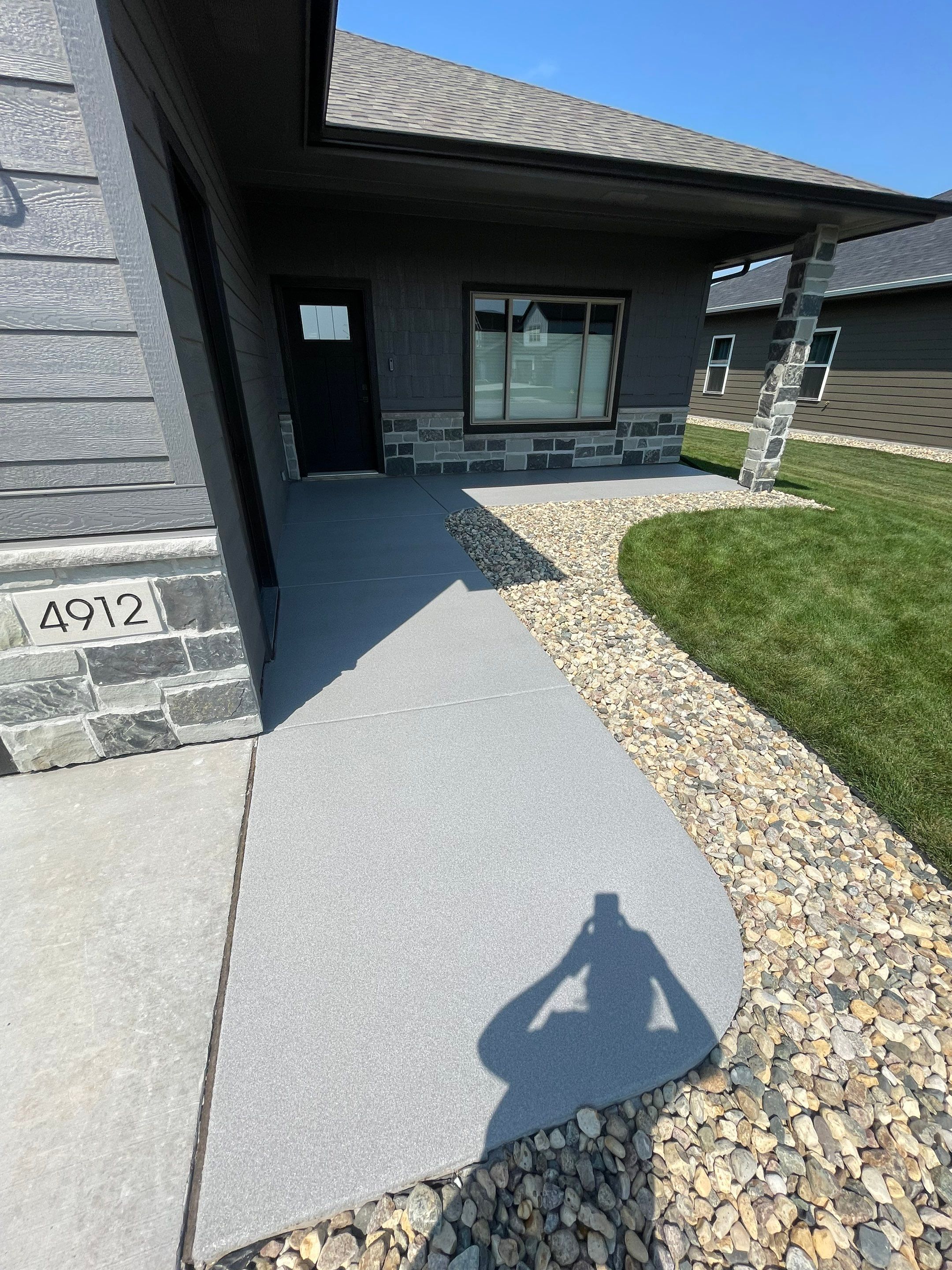 Sioux Falls Residential Concrete Patio and Walkway Coating by Select Painting, Coatings & Garage Cabinets