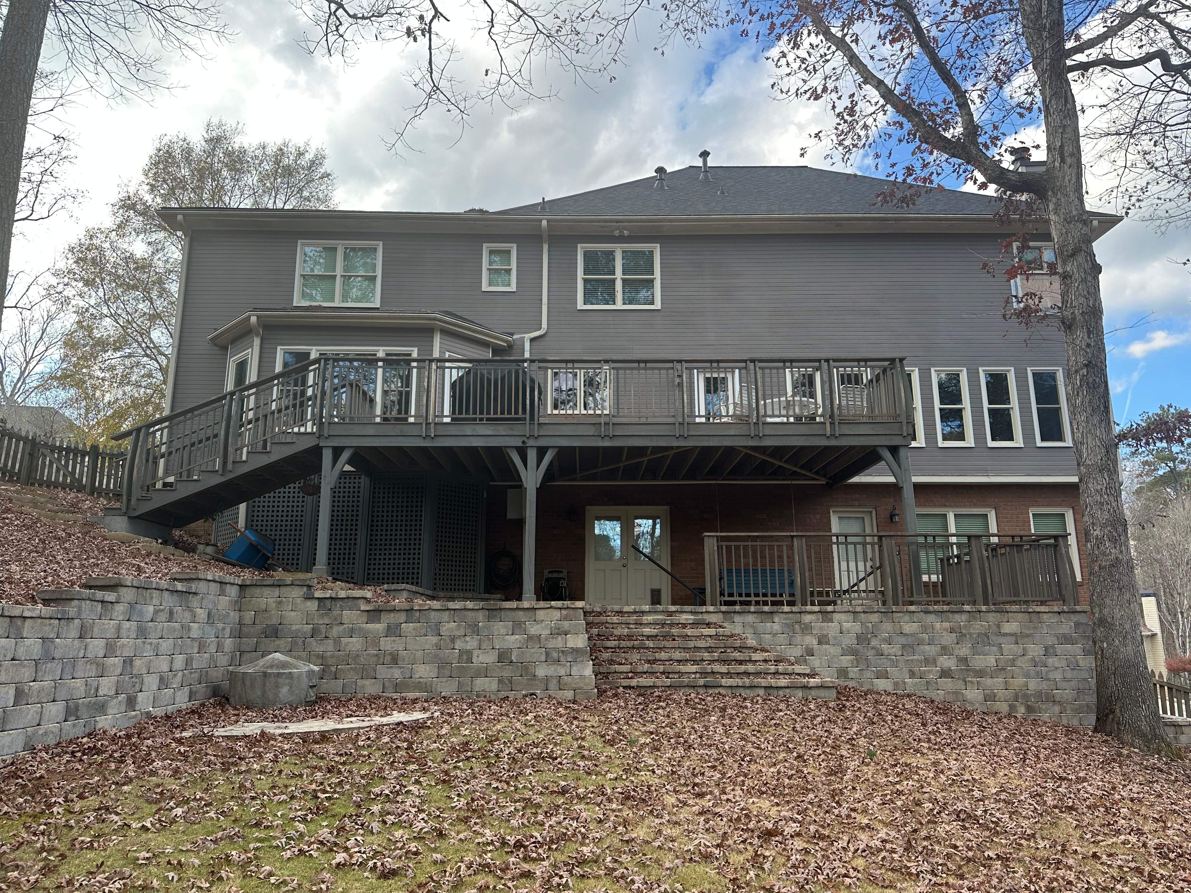 James Hardie Siding Replacement, Exterior Painting, Deck Stain, and Gutter Installation in Peachtree Corners, GA by Nelson Exteriors