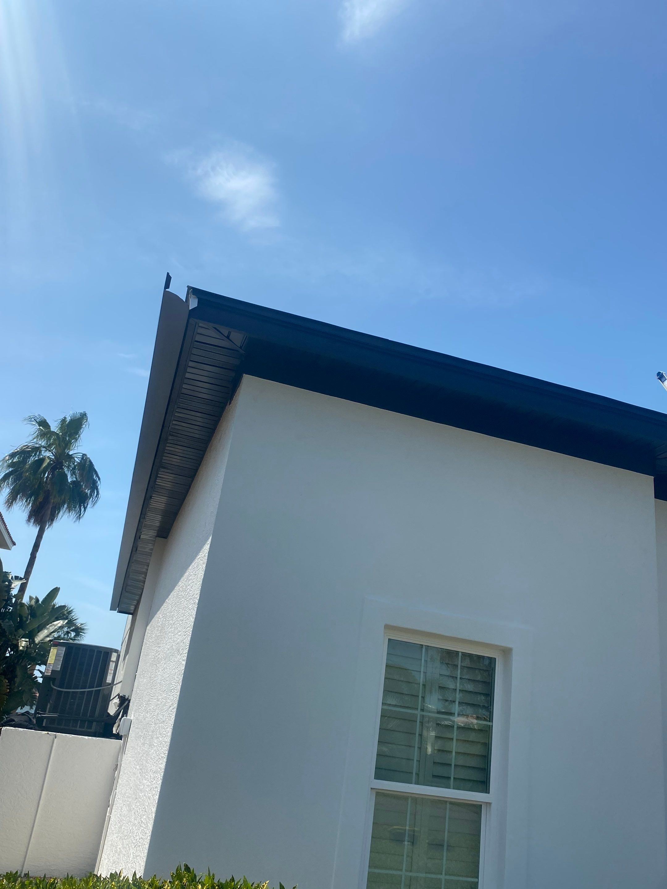 Soffit and Fascia Installation and black seamless gutters in Sarasota FL by Gutter Professors
