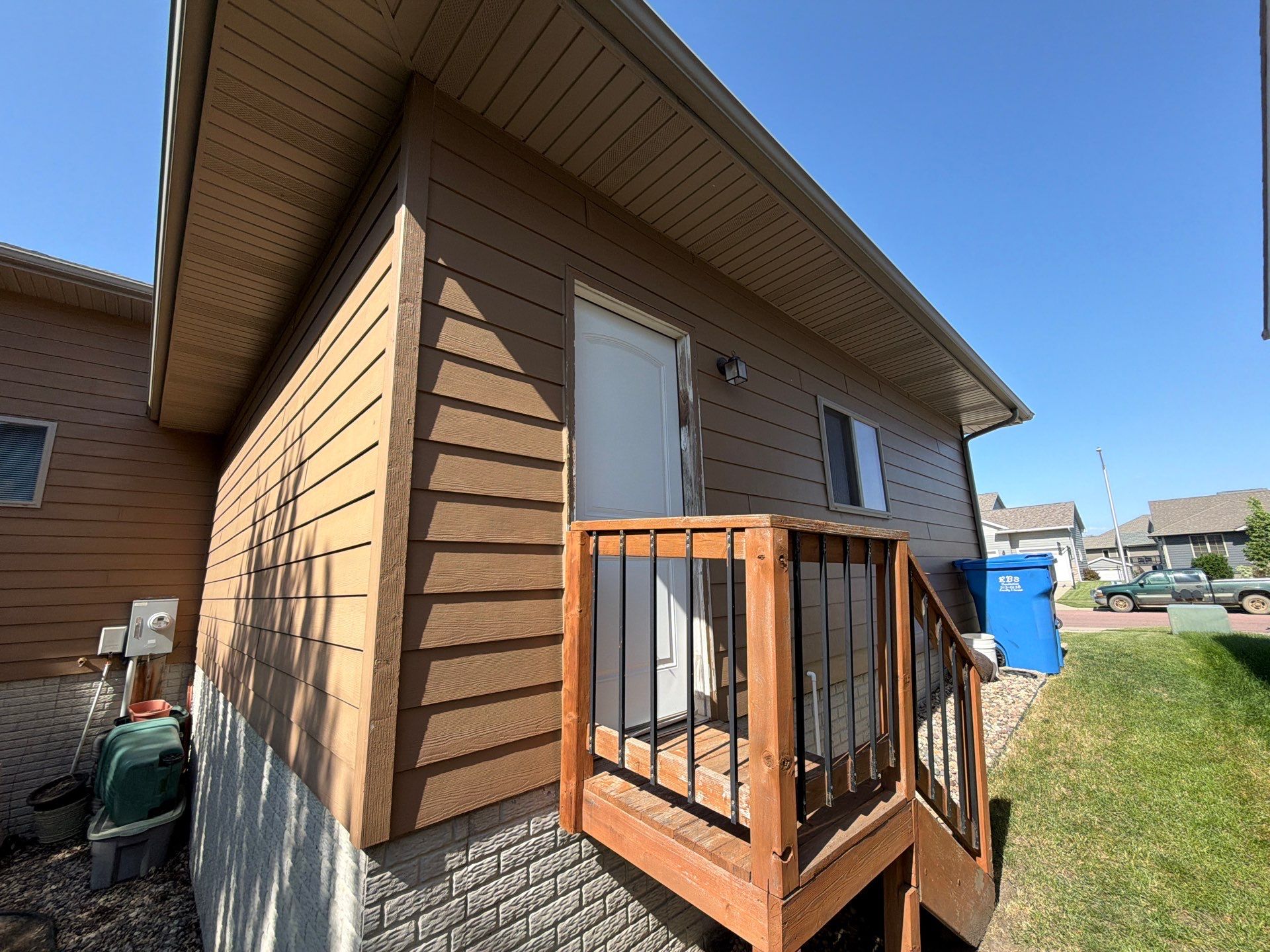 Full Exterior Residential Painting and Siding Refresh in Tea by Select Painting, Coatings & Garage Cabinets