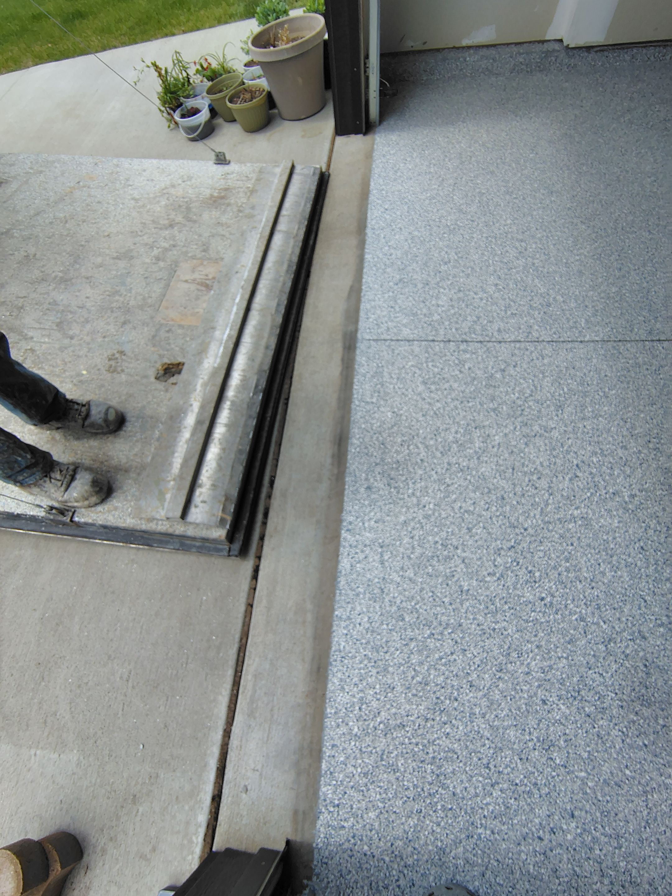 Custom Epoxy Garage Floor Coating Installation in Sioux Falls by Select Painting, Coatings & Garage Cabinets