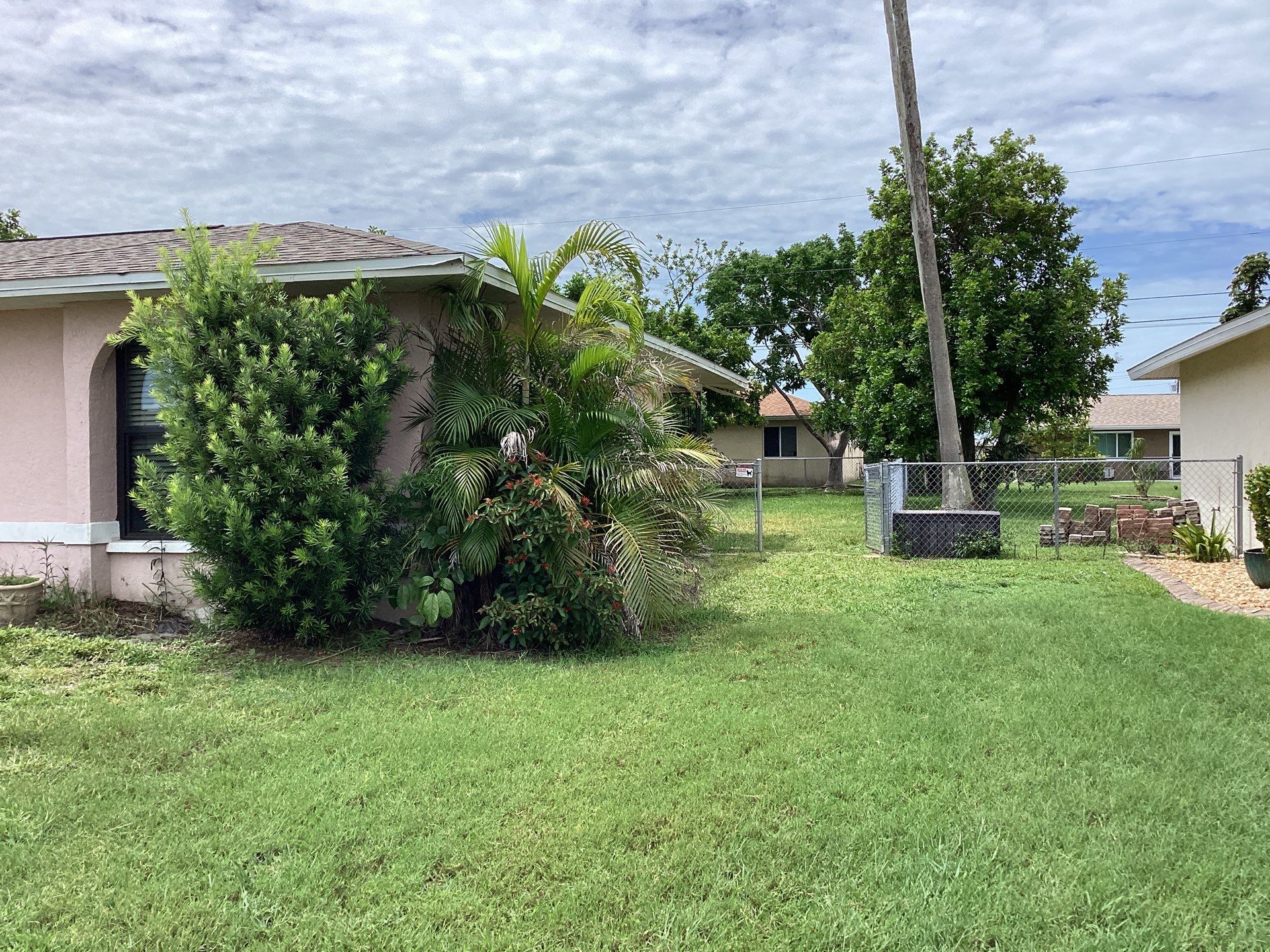 Replace gutter using White Down Spouts in Cape Coral FL by Gutter Professors