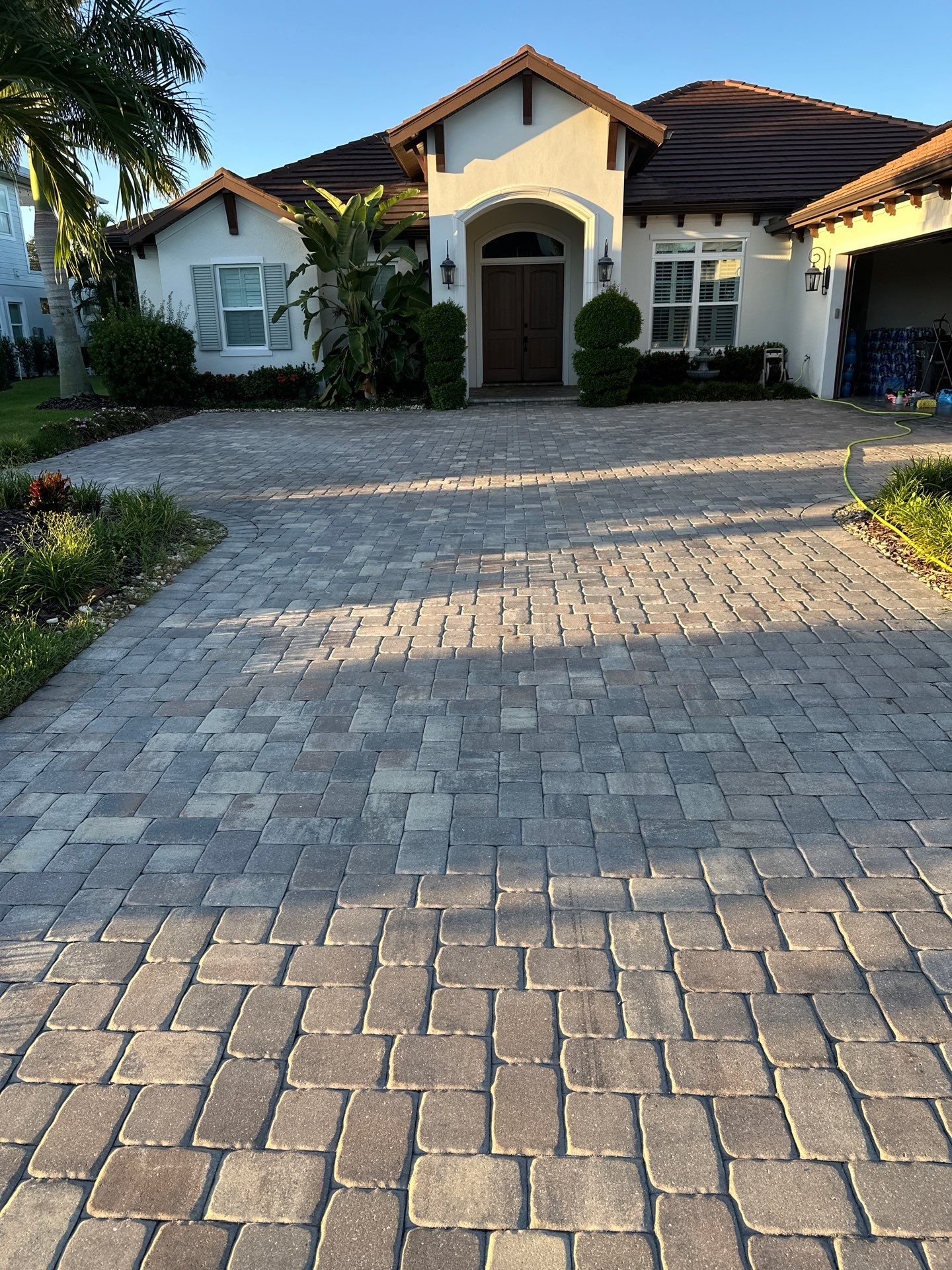 Paver Driveway, Sidewalk, and Pool Deck Cleaning in Winding River Community, Bradenton, FL by Sunshine AquaWash