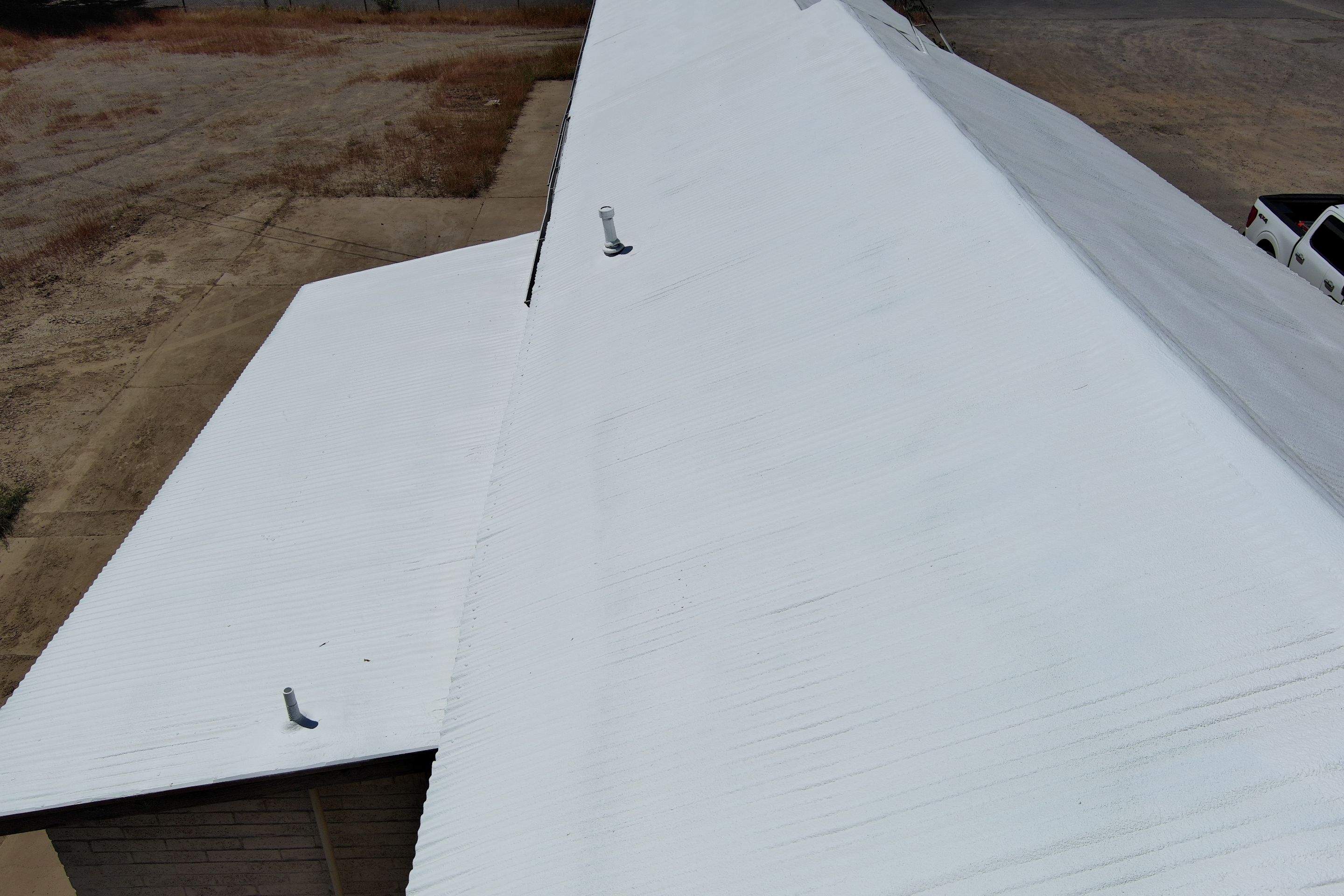 Spray foam and coatings using Conklin Benchmark/PUMA XL by Straight Edge Roofing Inc