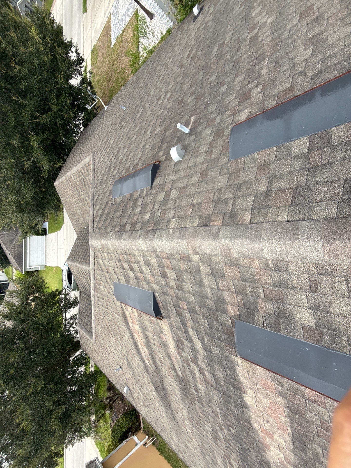 Residential Asphalt Shingle Roof Installation with Solar Ventilation in Davenport by JHI Roofing