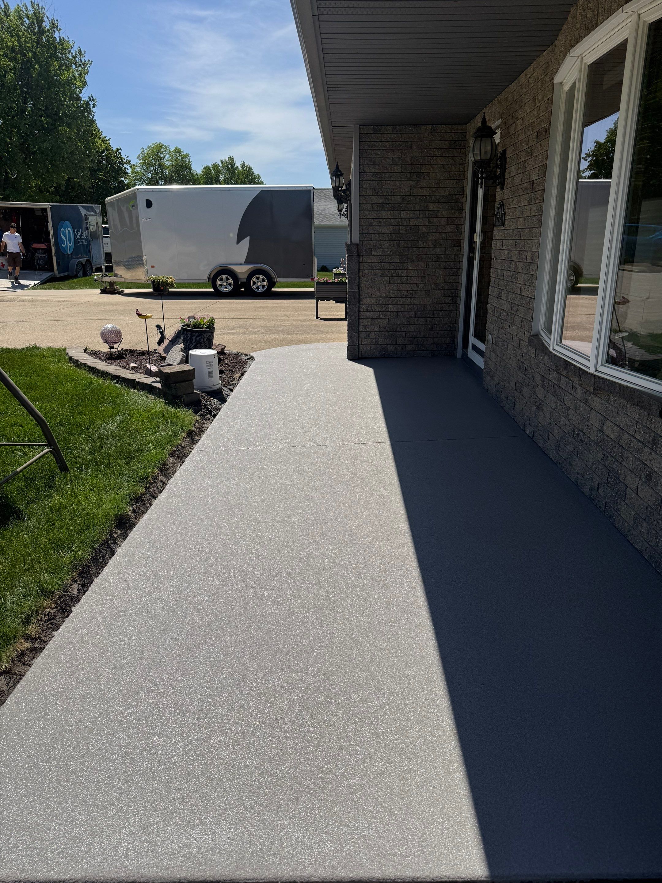 Custom Grey Flake Epoxy Garage Floor Installation in Remsen by Select Painting, Coatings & Garage Cabinets