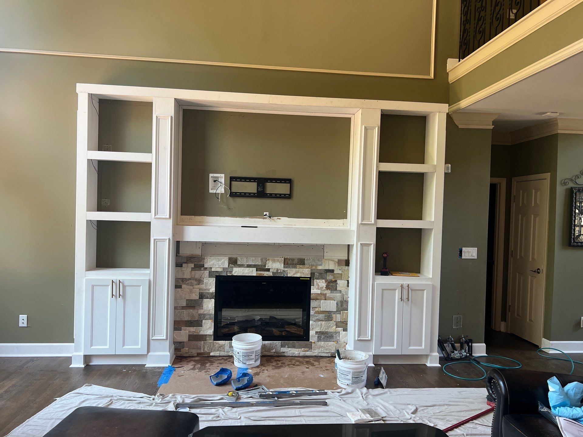 Custom Stone Fireplace and White Built-in Cabinetry in Suwanee by Swift Home Renovations