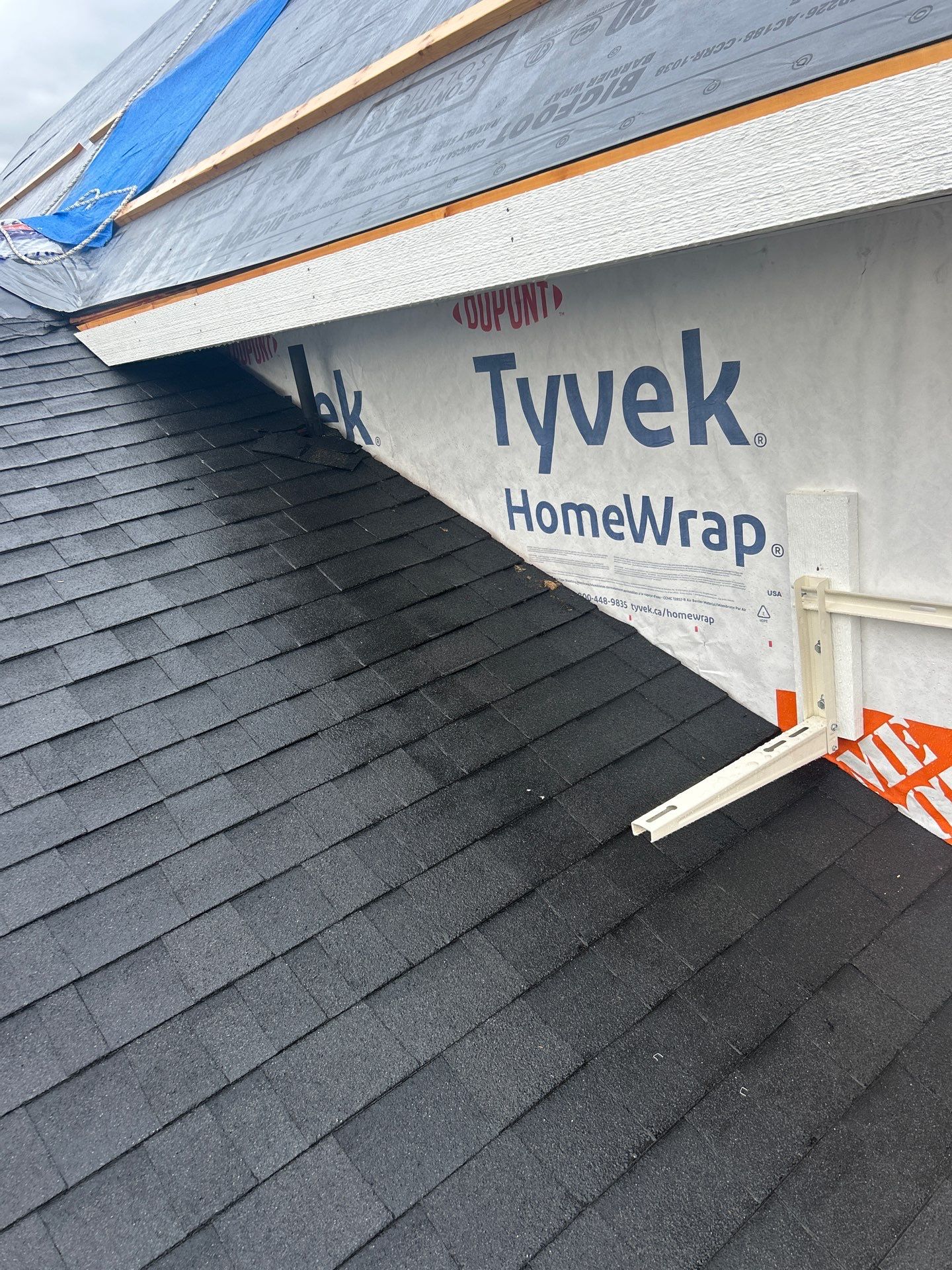 Residential Roofing Installation using OC onyxs black shingle by Top Notch Roofing Inc