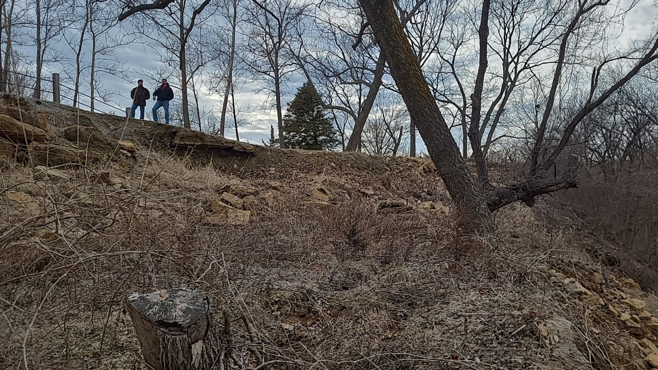 Supporting back of home with backfill at edge of steep creek by LAND ESCAPES LLC