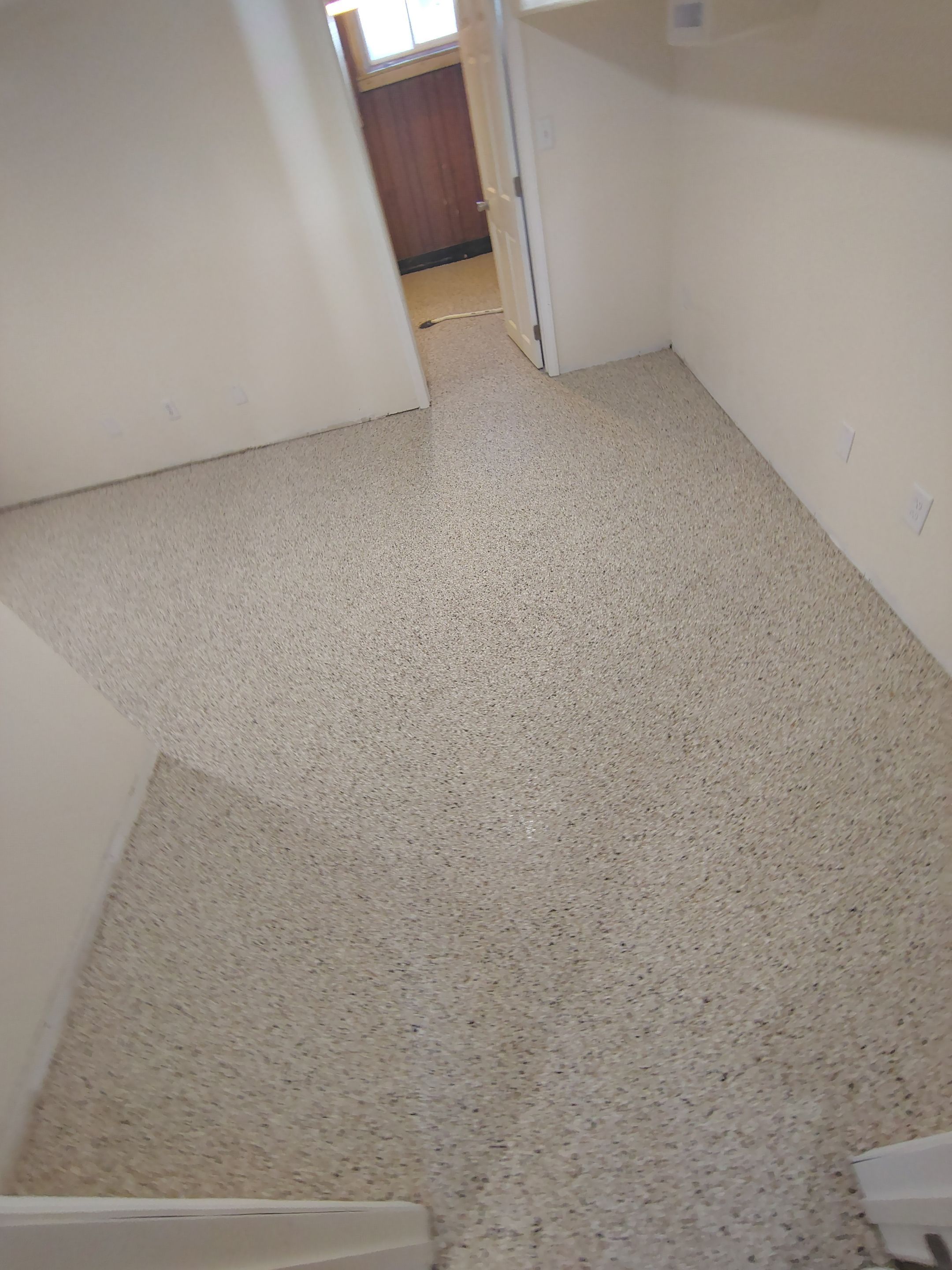 Comprehensive Basement Concrete Floor Coating and Crack Repair in Sioux Falls by Select Painting, Coatings & Garage Cabinets