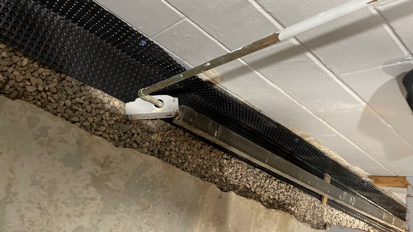 Drain Tile, Sump Pump & Buried Discharge in Columbia Heights by Waterproofing Northeast