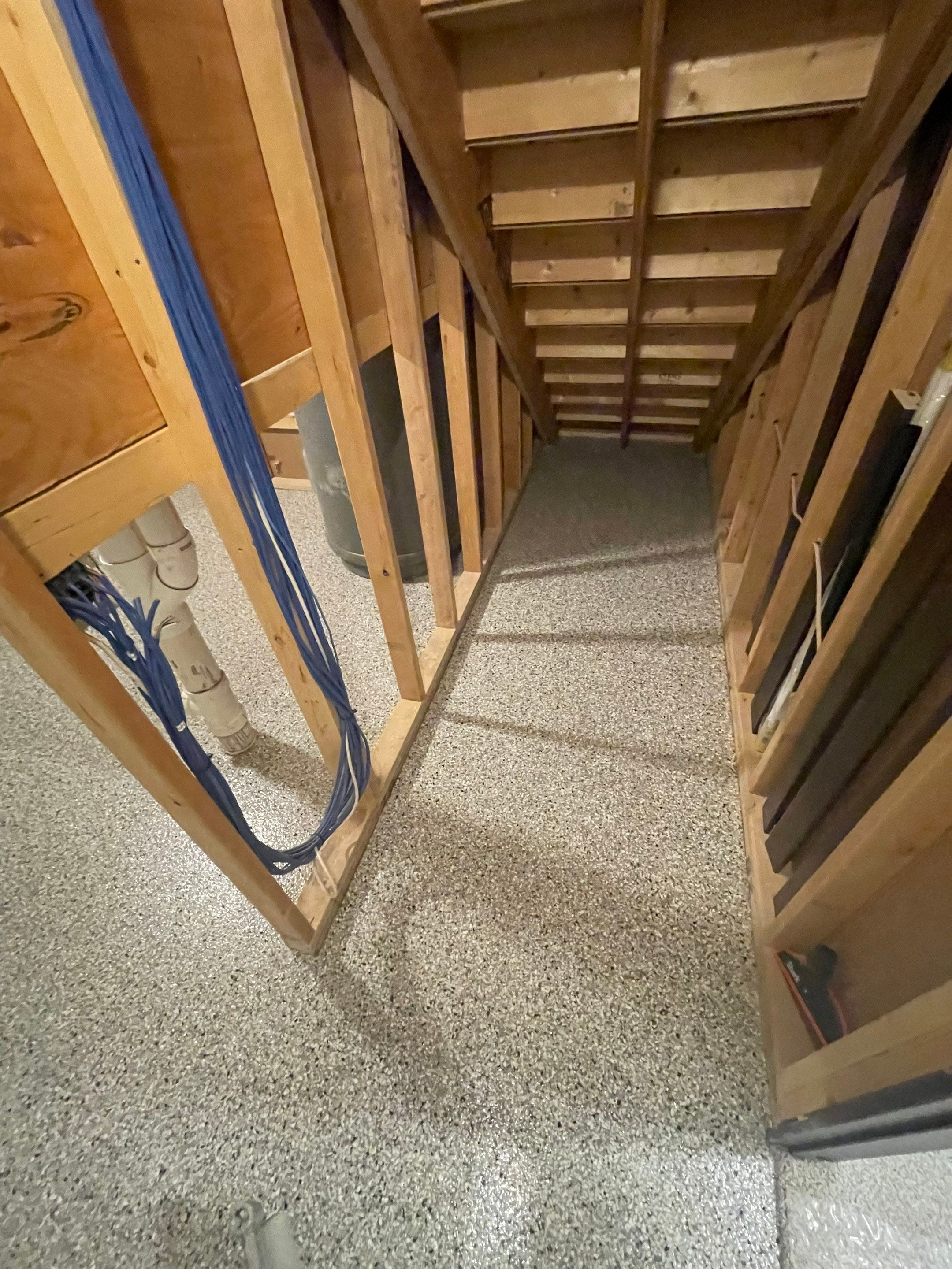 Sioux Falls Basement Floor Transformation with Durable Epoxy Flake Coating by Select Painting, Coatings & Garage Cabinets